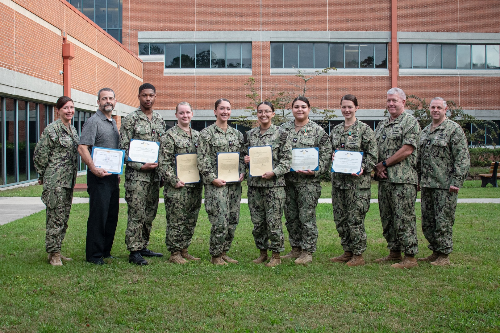 Naval Health Clinic Cherry Point recognized Sailors and staff at an awards ceremony held Wednesday, September 25 aboard Marine Corps Air Station Cherry Point.
Those recognized, from left to right were Mr. Kevin Murphy as Senior Employee of the Quarter, Hospital Corpsman Second Class Jabari Parker with the Navy and Marine Corps Achievement Medal, Hospital Corpsman Second class Kaytelyn Barros as Sailor of the Quarter, Hospital Corpsman Third Class Vanessa Schoefield as Junior Sailor of the Quarter, Hospitalman Nidya Salazar as Junior Sailor of the Quarter, Hospital Corpsman Third Class Alyssa Gastelum with the Navy and Marine Corps Achievement Medal and Hospital Corpsman Second Class Victoria Synoground with the Navy and Marine Corps Achievement Medal.