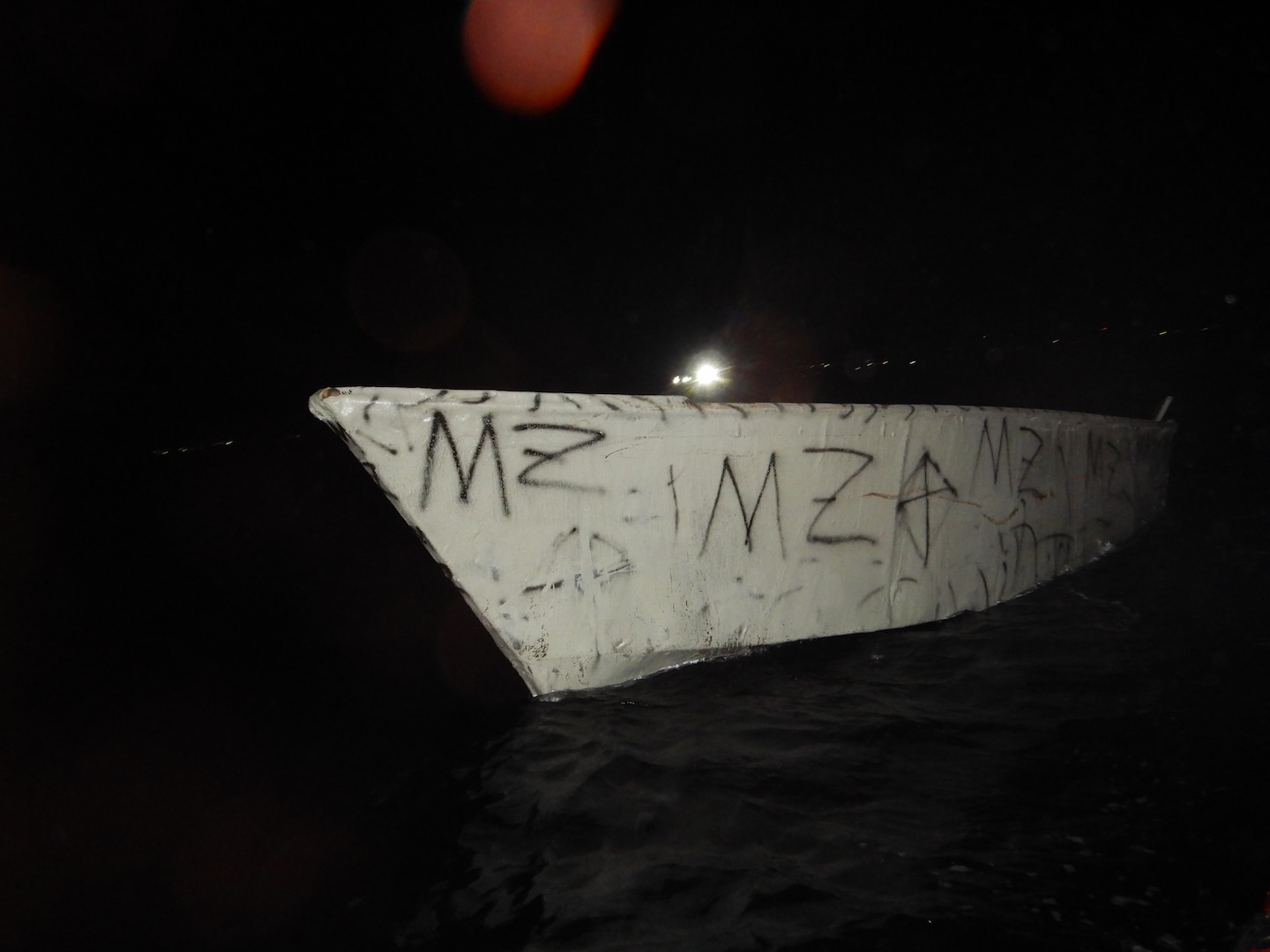 Coast Guard Cutter Kathleen Moore interdicts an overloaded makeshift vessel with 50 migrants in Mona Passage waters north of Mona Island, Puerto Rico, Sept. 23, 2024.  Forty-six migrants in this group were repatriated to at-sea to Dominican Republic Navy authorities just off Punta Cana, Dominican Republic, Sept. 26, 2024. (U.S. Coast Guard photo)