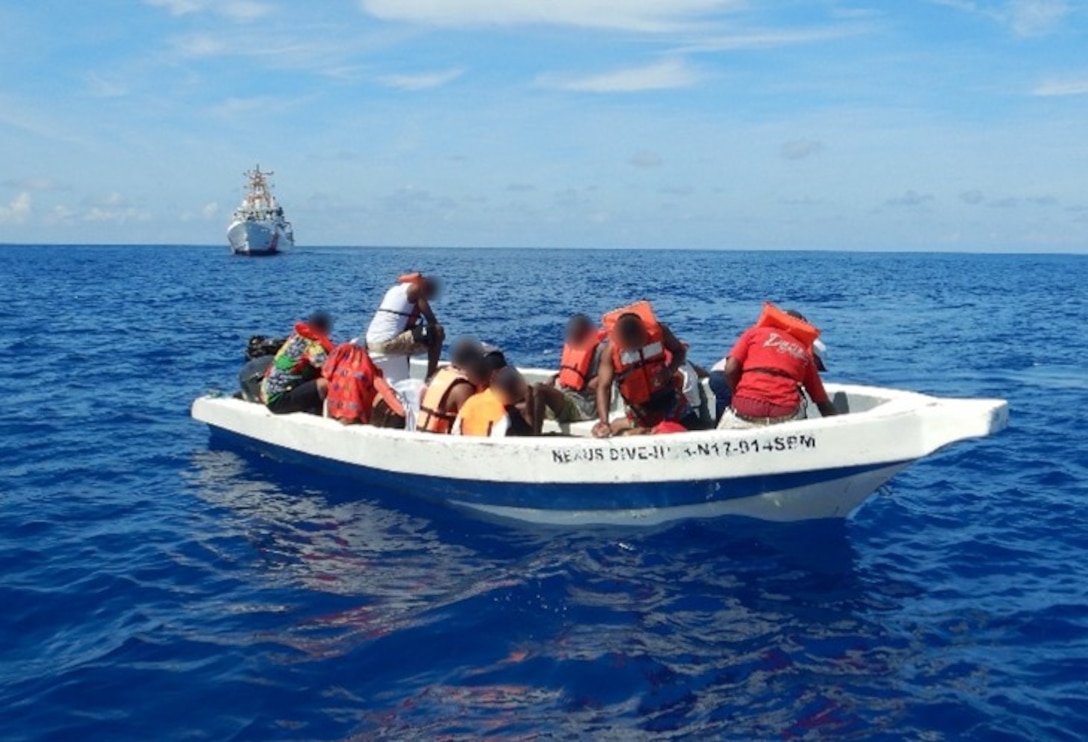 Coast Guard Cutter Kathleen Moore interdicts an overloaded makeshift vessel with 14 migrants in Mona Passage waters north of Mona Island, Puerto Rico, Sept. 23, 2024.  The migrant group was repatriated at-sea to Dominican Republic Navy authorities just off Punta Cana, Dominican Republic, Sept. 25, 2024. (U.S. Coast Guard photo)