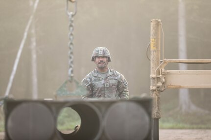 U.S. Army Spc. Randy Garcia, a High Mobility Rocket System crewmember assigned to Alpha Battery, 4th Battalion, 133rd Field Artillery Regiment, Texas Army National Guard, supporting 1st Cavalry Division, unloads the rockets from his vehicle for a Table XII live-fire exercise near Tapa, Estonia, Sept. 19, 2024. The 1st Cavalry Division’s mission in Europe is to engage in multinational training and exercises across the continent, working alongside NATO allies and regional security partners to provide combat-credible forces to V Corps, America’s forward-deployed corps in Europe.