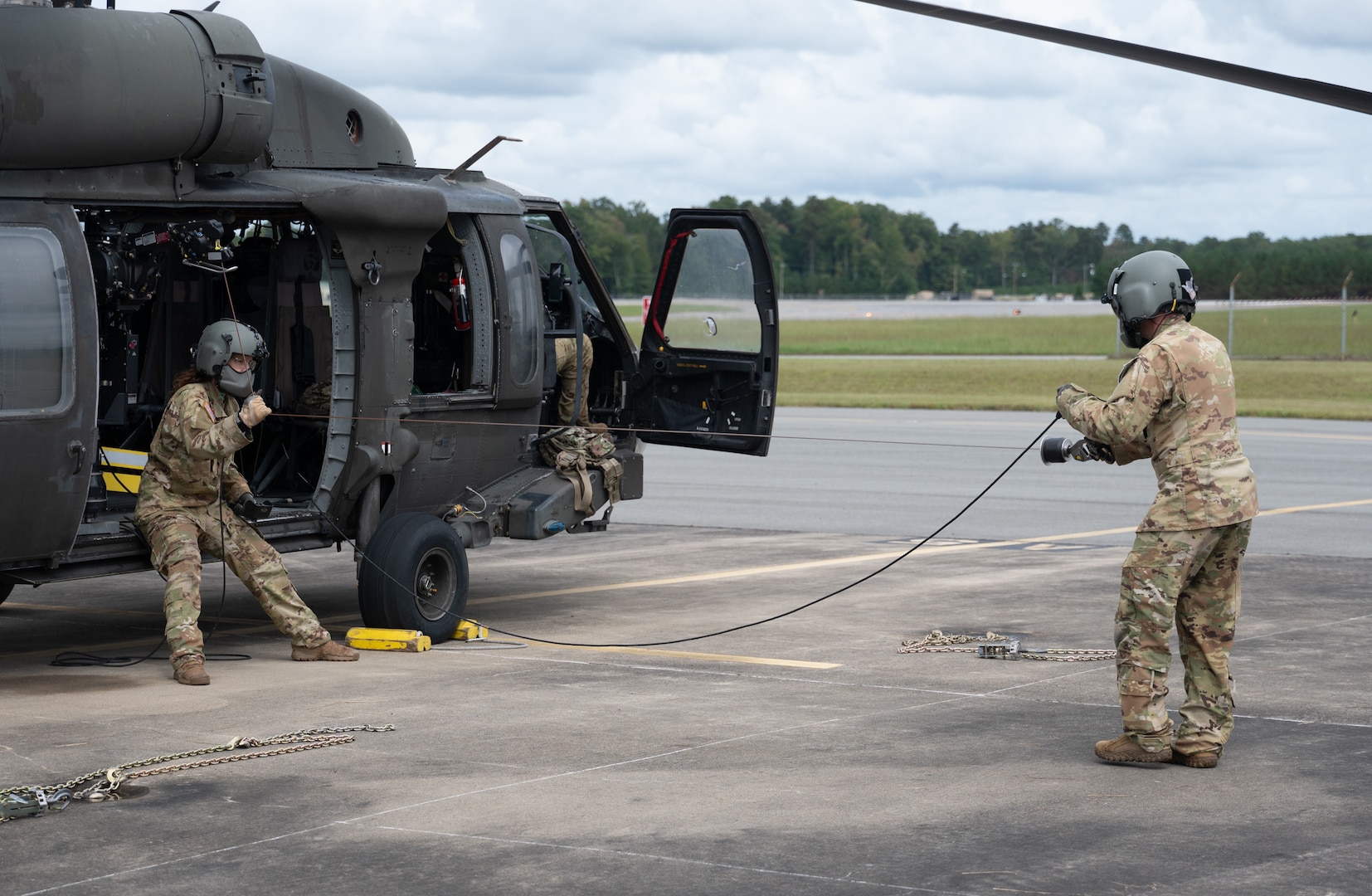 Virginia National Guard Soldiers assigned to the Sandston-based 2nd Battalion, 224th Aviation Regiment, 29th Infantry Division, prepare UH-60 Black Hawks for possible missions related to Hurricane Helene Sept. 26, 2024, at the Army Aviation Support Facility in Sandston, Virginia.