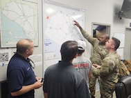 Florida Army National Guard, State Guard, local law enforcement, EMS, and fire personnel work together at an emergency operations center in Perry, Fla., Sept. 26, 2024. Response to Hurricane Helene is a massive team effort, and FLARNG fully mobilizes all available forces.