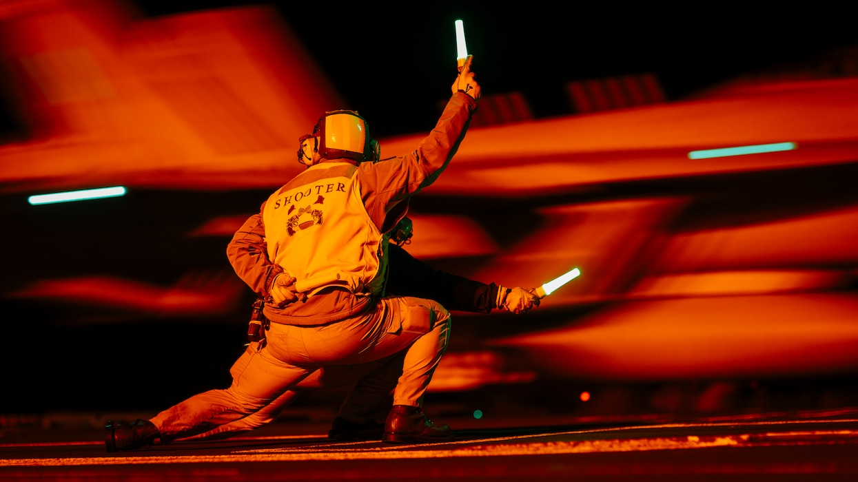 Lt. Cmdr. John Brennan and Lt. Sarah Amorio launch an F/A-18F Super Hornet from VFA-122 aboard USS George Washington (CVN 73)  in the Pacific Ocean.