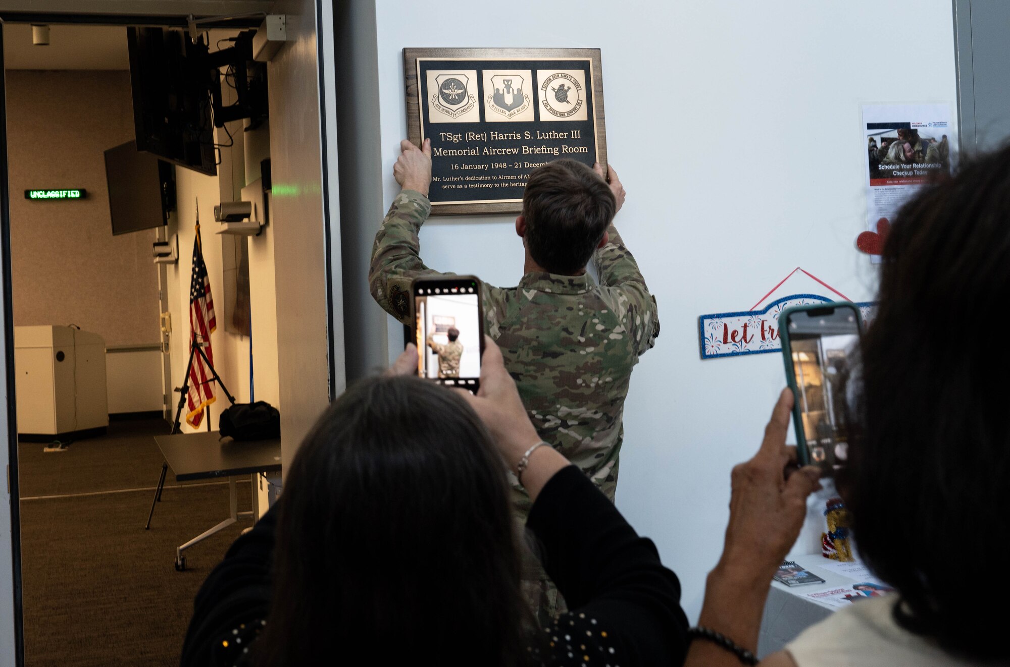 U.S. Airman hangs sign