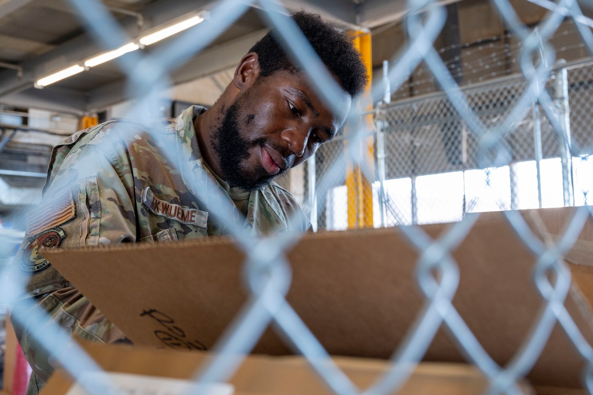 U.S. Air Force Senior Airman Uchenna Ekwueme, 635th Materiel Maintenance Support Squadron cargo movement technician, processes an inbound shipment at Holloman Air Force Base, New Mexico, Sept. 18, 2024.