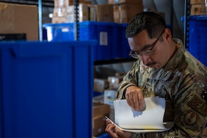 U.S. Air Force Senior Airman Robert Pineda, 635th Materiel Maintenance Support Squadron electric decentralized materiel support journeyman, validates inventory at Holloman Air Force Base, New Mexico, Sept. 18, 2024.