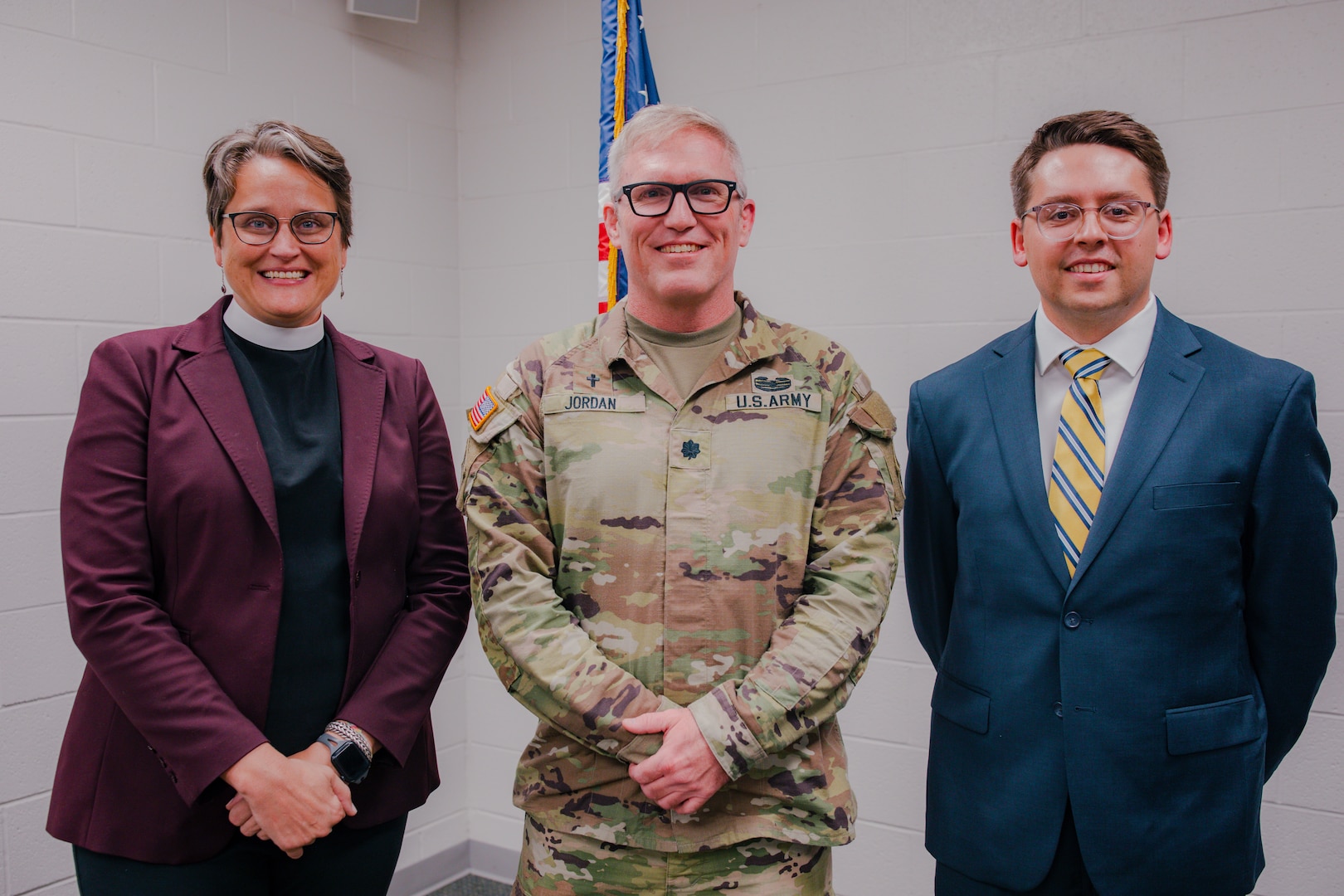 Lt. Col. David Jordan, full-time support chaplain for the Oklahoma National Guard, stands with new Oklahoma Army National Guard Chaplain Corps members, Capt. Stephanie Jenkins and 2nd Lt. Jesse Johnston during a commissioning ceremony in Oklahoma City,  Sept. 25, 2024. The mission of a chaplain is two-fold, impacting both individual Soldiers and overall mission readiness. This role includes providing religious support for Soldiers as well as advising the command on religious impacts of missions within the organization. (Oklahoma National Guard photo by Staff Sgt. Reece Heck)