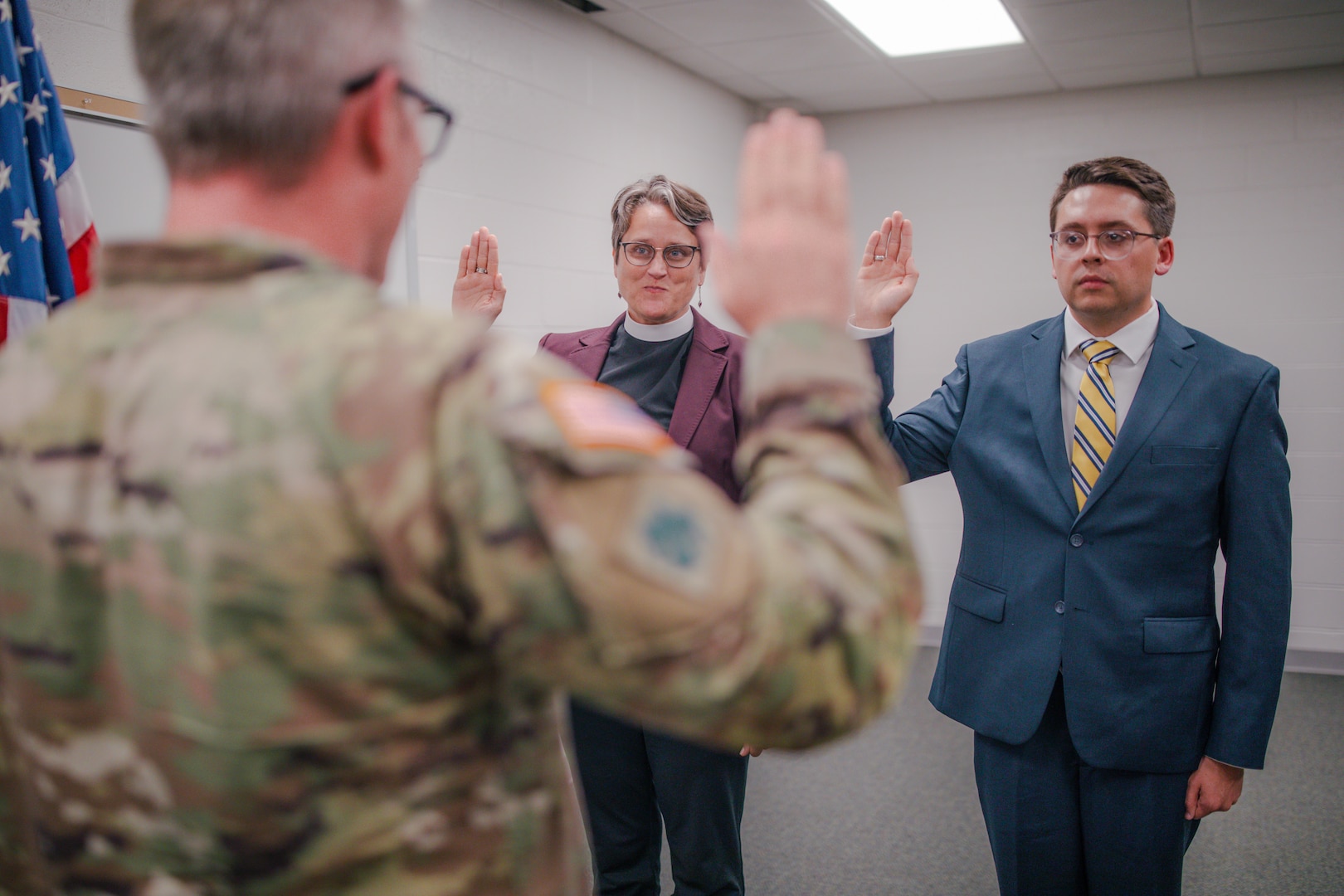 Capt. Stephanie Jenkins and 2nd Lt. Jesse Johnston take the Oath of Commissioned Officers as a newly commissioned chaplain and chaplain candidate in the Oklahoma Army National Guard during a commissioning ceremony in Oklahoma City, on Sept. 25, 2024. The mission of a chaplain is two-fold, impacting both individual Soldiers and overall mission readiness. This role includes providing religious support for Soldiers as well as advising the command on religious impacts of missions within the organization. (Oklahoma National Guard photo by Staff Sgt. Reece Heck)