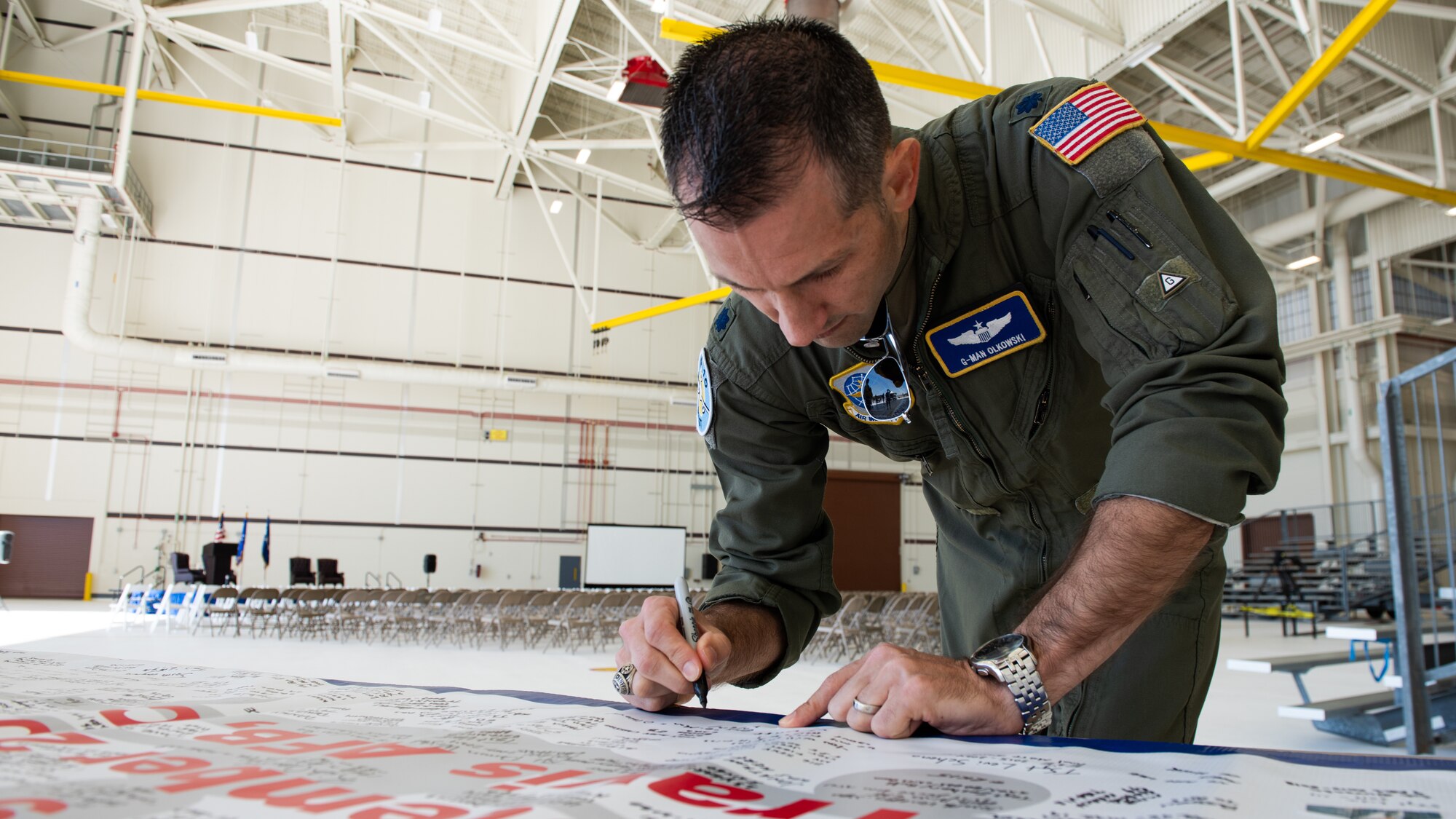 Airman signing farewell banner