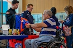 Attendees look at emergency kits.