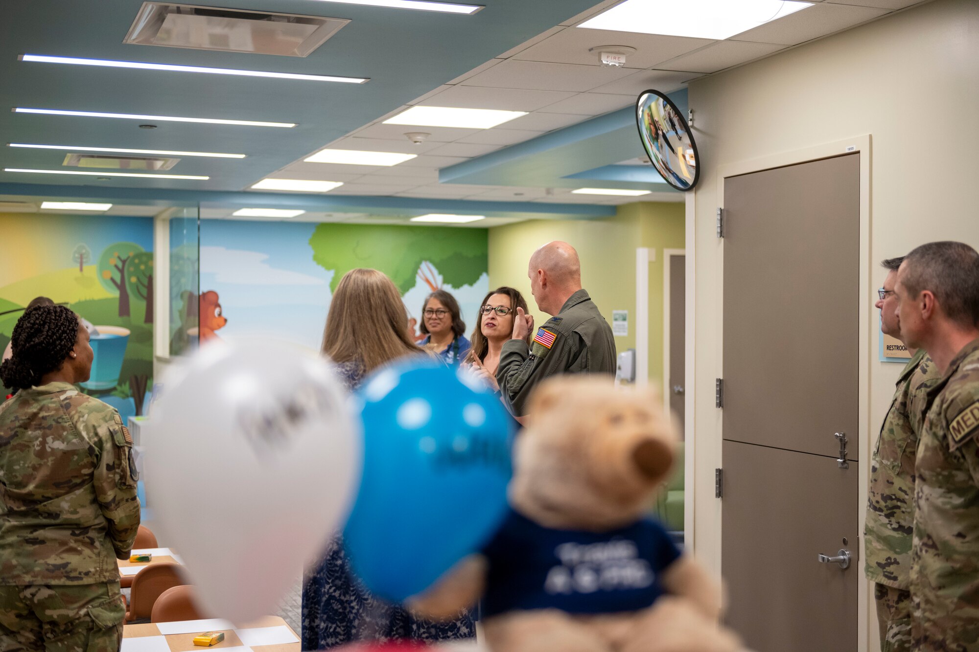 Teddy's Child Watch staff show 60th AMW commander the facility