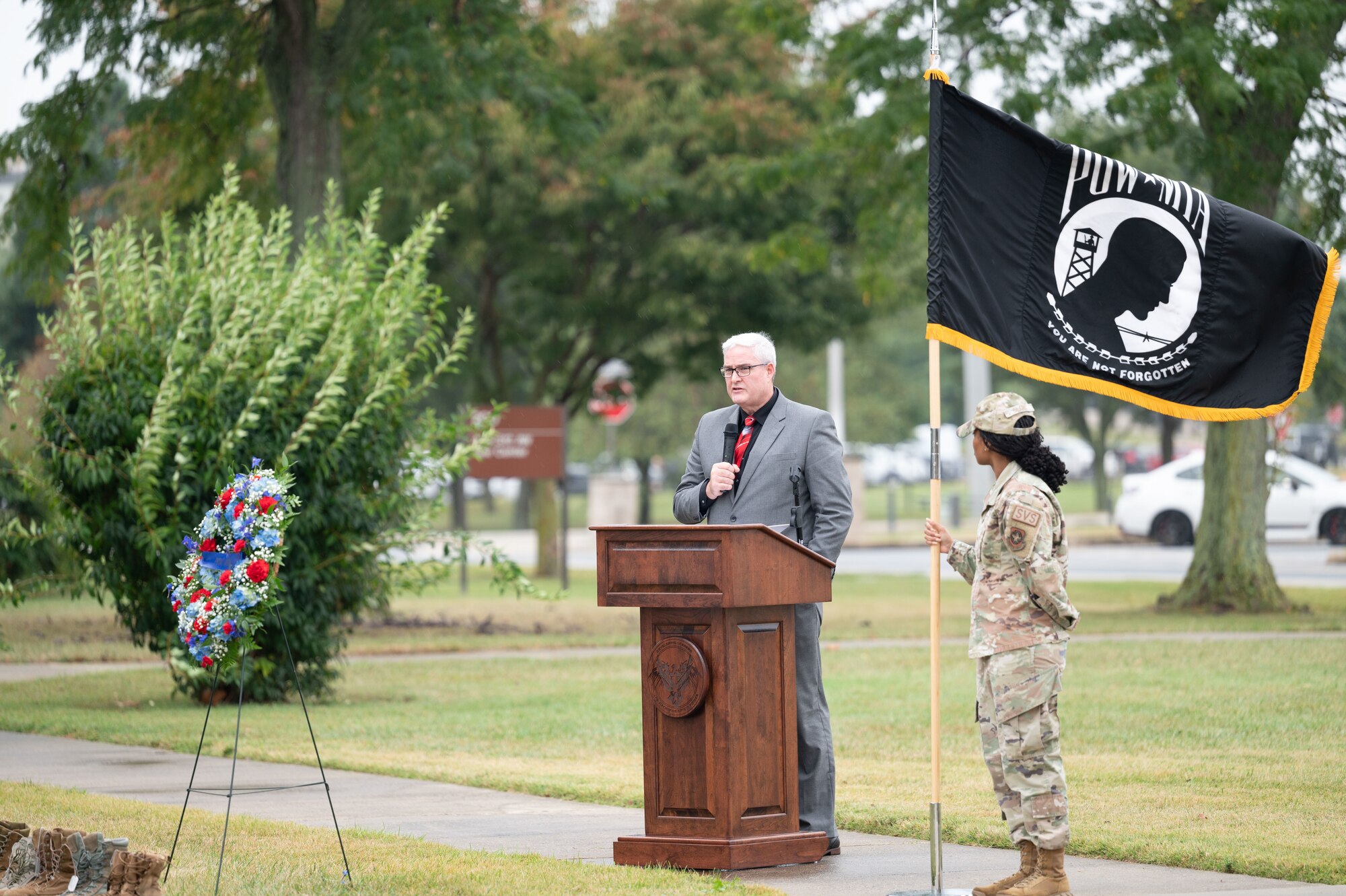 Dr. Tim McMahon, Armed Forces Medical Examiner System director of DNA operations, gives remarks at the POW/MIA Recognition Day retreat ceremony at Dover Air Force Base, Delaware, Sept. 27, 2024. In recognition of POW/MIA, Team Dover held a 24-hour ruck that was followed by a closing retreat ceremony, honoring all military personnel who have been taken captive and returned, as well as those who remain missing. (U.S. Air Force photo by Airman Liberty Matthews)