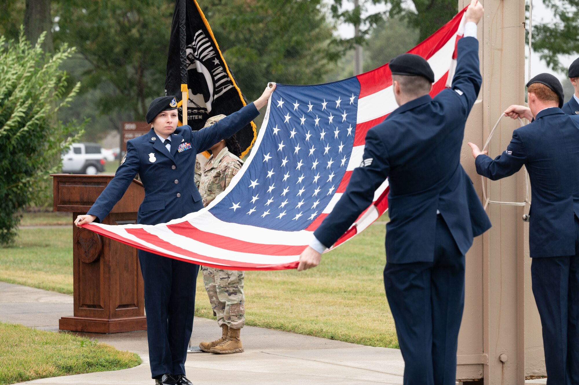 The Dover Air Force Base color guard folds the U.S. flag at the POW/MIA Recognition Day retreat ceremony at Dover AFB, Delaware, Sept. 27, 2024. In recognition of POW/MIA, Team Dover held a 24-hour ruck that was followed by a closing retreat ceremony, honoring all military personnel who have been taken captive and returned, as well as those who remain missing. (U.S. Air Force photo by Airman Liberty Matthews)