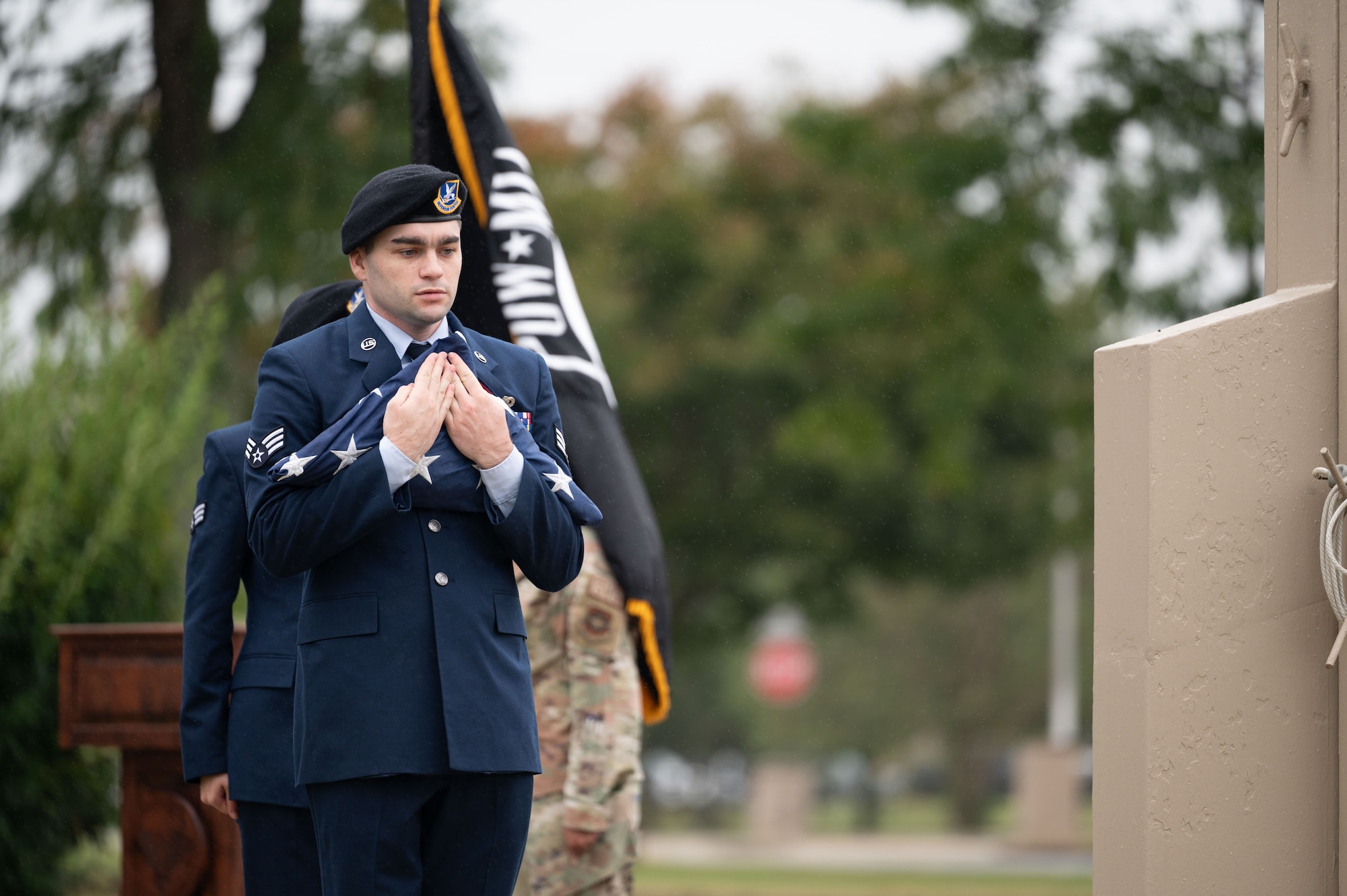 A member of the Dover Air Force Base color guard holds the U.S. flag at the POW/MIA Recognition Day retreat ceremony at Dover AFB, Delaware, Sept. 27, 2024. In recognition of POW/MIA, Team Dover held a 24-hour ruck that was followed by a closing retreat ceremony, honoring all military personnel who have been taken captive and returned, as well as those who remain missing. (U.S. Air Force photo by Airman Liberty Matthews)