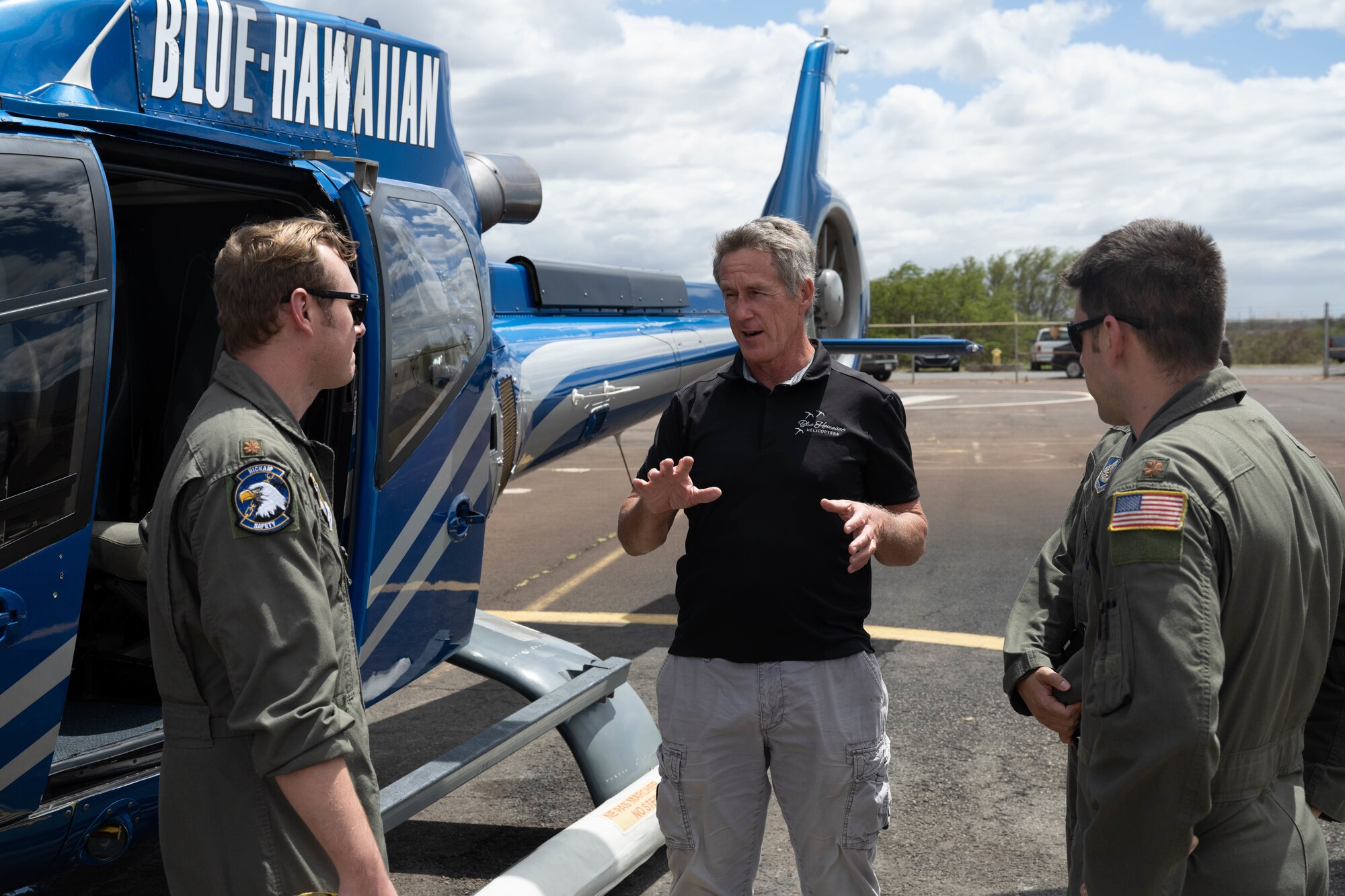 The 15th Wing Safety personnel speaks with a local helicopter crew team member on Maui, Hawaii, Sept. 26, 2024. The 15th Wing Safety Office aims to build new connections within general aviation communities across the Hawaiian Islands.  (U.S. Air Force photo by Airman 1st Class Aden Brown)