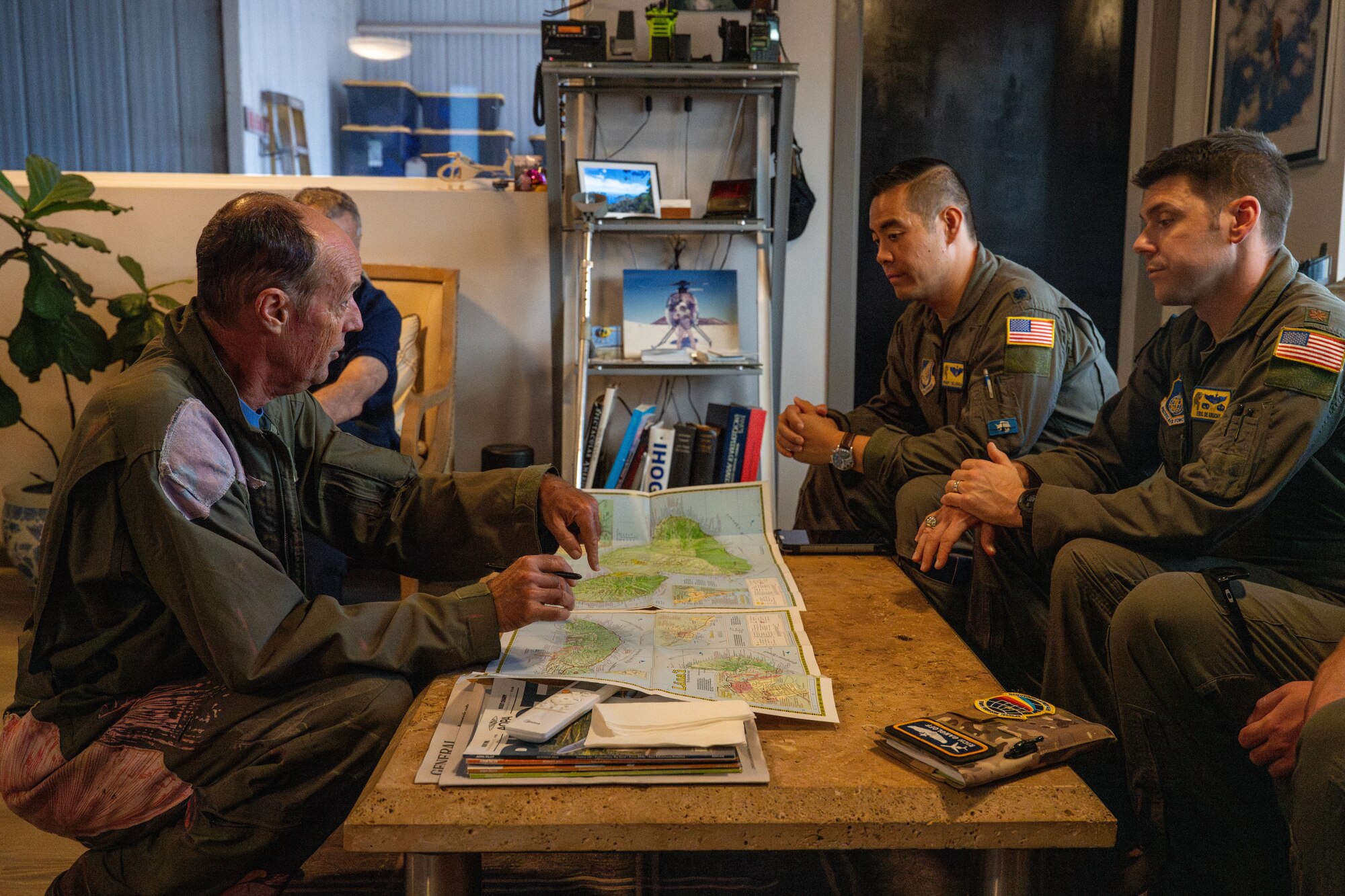 U.S. Air Force Lt. Col. Reinier Villanueva, 15th Wing Chief of Safety, and U.S. Air Force Maj. Eric De Gruchy, 15th Wing Safety officer, speaks with a local flight academy’s helicopter team on Maui, Hawaii, Sept. 26, 2024. The 15th Wing Safety Office aims to build new connections within general aviation communities across the Hawaiian Islands.  (U.S. Air Force photo by Airman 1st Class Aden Brown)