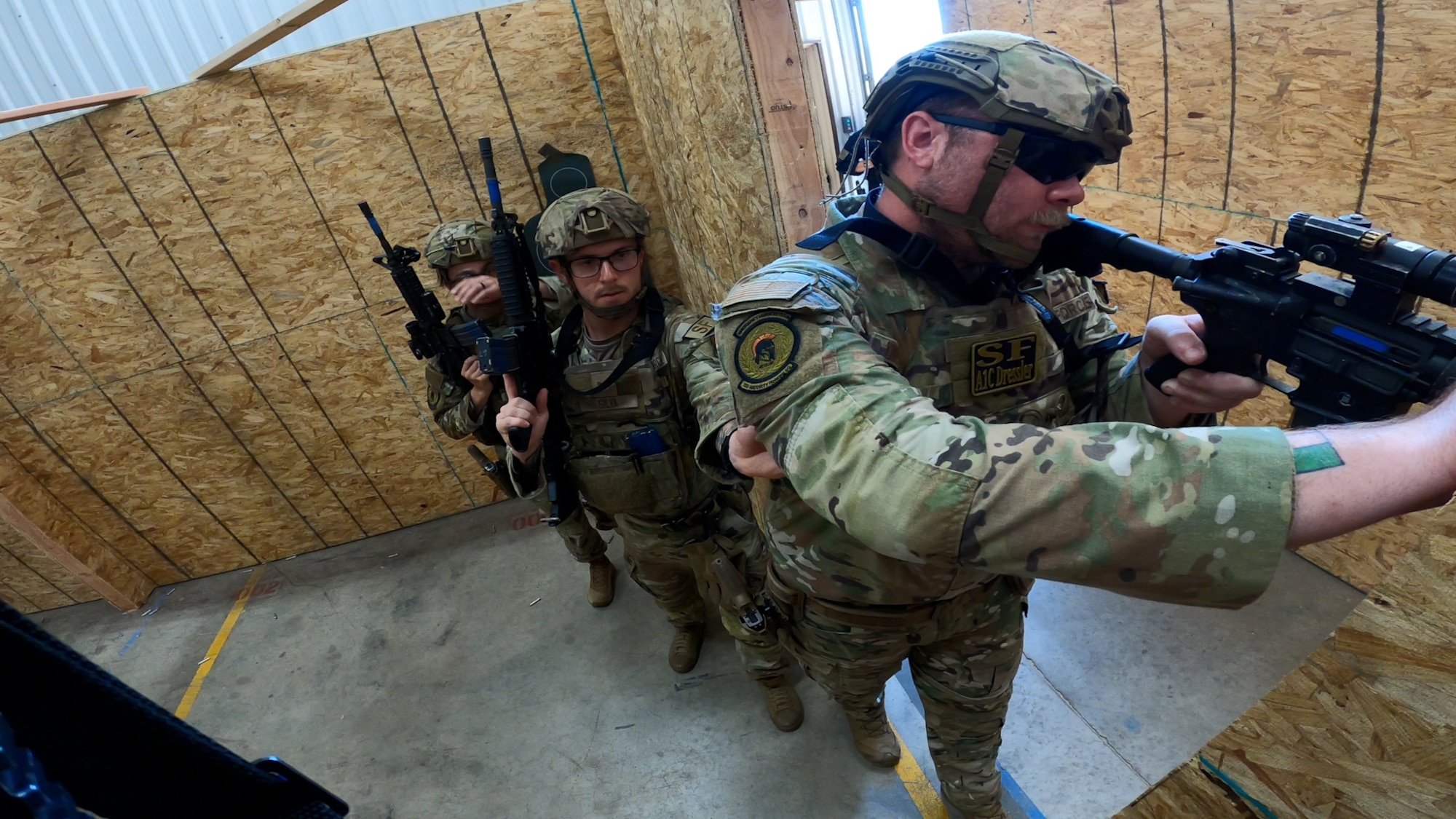 defenders standing with guns