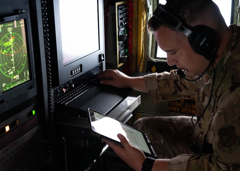 Airman reviewing data on computer