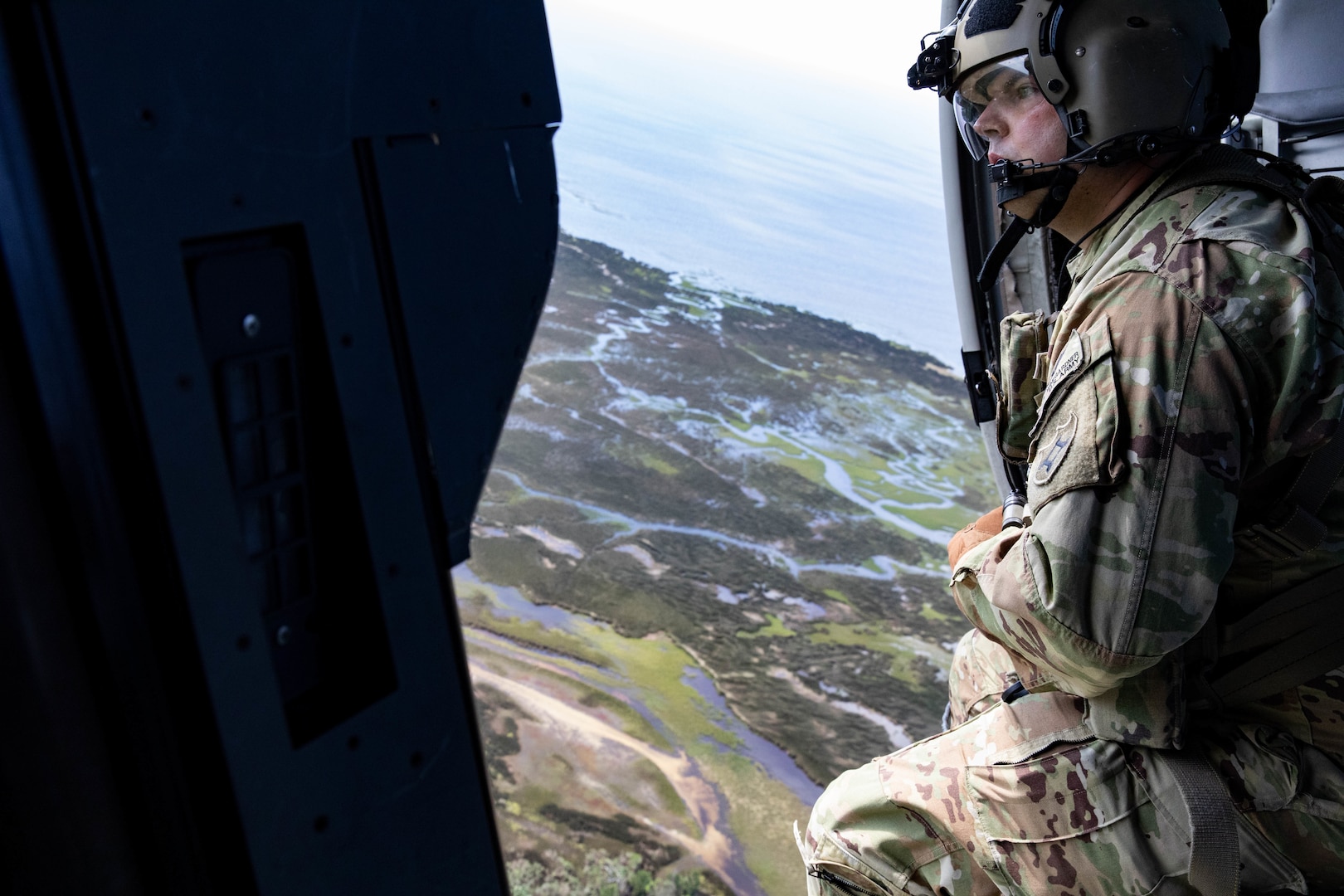 Sgt. Justin Wingarder, a crew chief from the Florida Army National Guard’s 1st Battalion, 111th Aviation Regiment, conducts a search and rescue mission in an HH-60 Black Hawk helicopter outside Tallahassee International Airport Sept. 27, 2024. The FLARNG is well-equipped, featuring high-wheeled vehicles, helicopters, boats, and generators.