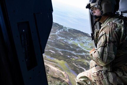 Sgt. Justin Wingarder, a crew chief from the Florida Army National Guard’s 1st Battalion, 111th Aviation Regiment, conducts a search and rescue mission in an HH-60 Black Hawk helicopter outside Tallahassee International Airport Sept. 27, 2024. The FLARNG is well-equipped, featuring high-wheeled vehicles, helicopters, boats, and generators.