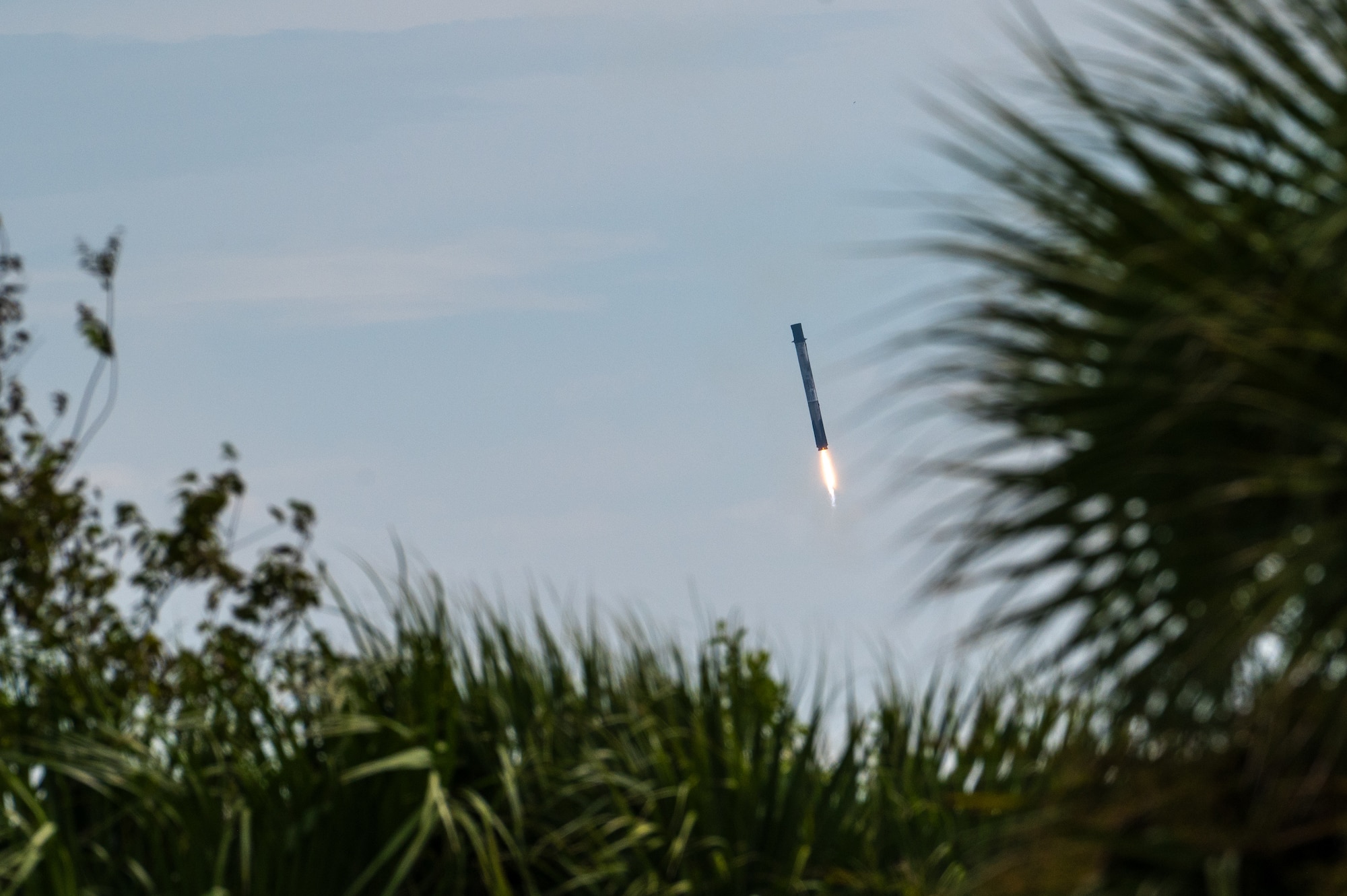 A booster returns to land.