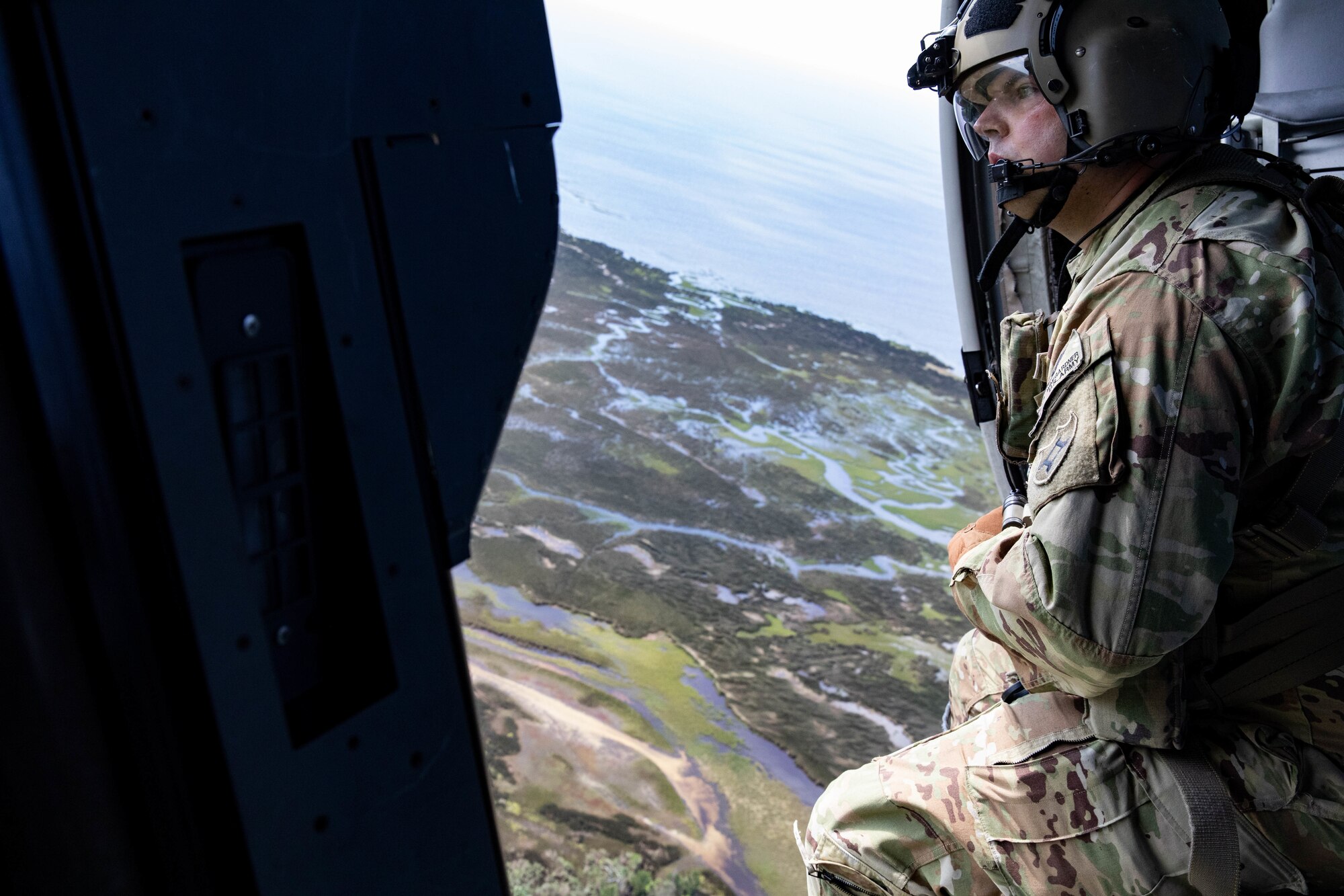 Sgt. Justin Wingarder, a crew chief from the Florida Army National Guard’s 1st Battalion, 111th Aviation Regiment, conducts a search and rescue mission in an HH-60 Black Hawk helicopter outside Tallahassee International Airport Sept. 27, 2024. The FLARNG is well-equipped, featuring high-wheeled vehicles, helicopters, boats, and generators.