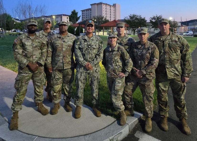 A group of soldiers pose for a photo.