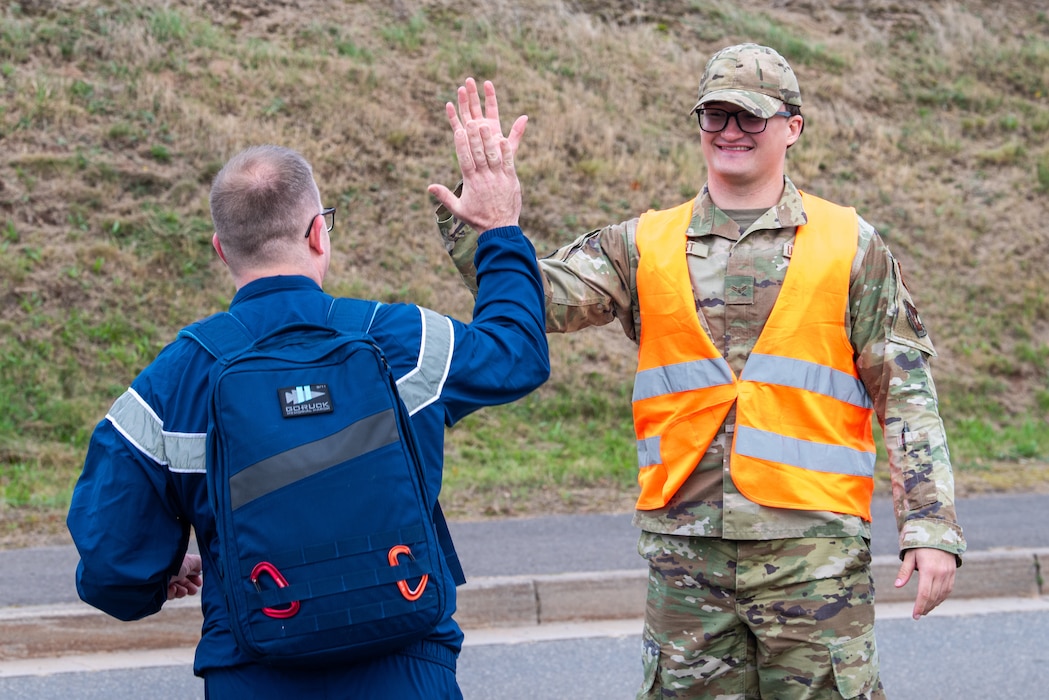 Airman gives high five.