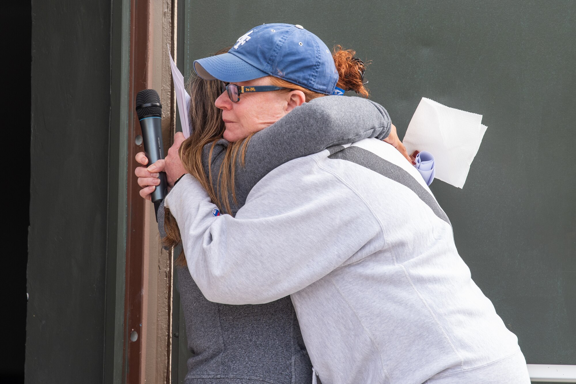 Brig. Gen. Adrienne Williams hugs Sheena Pinero at Hope in Motion 5k.