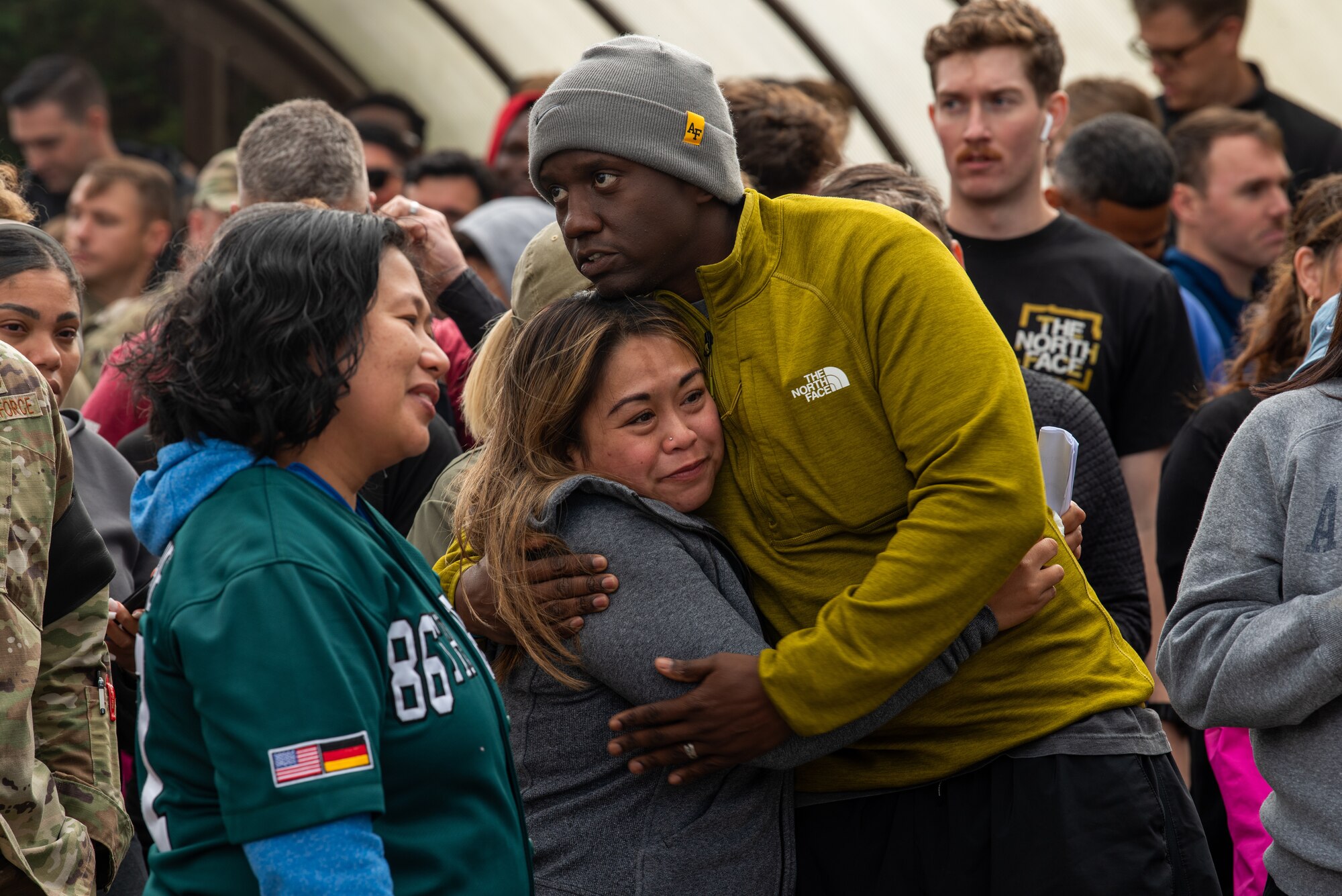 Sheena Pinero receives hug at ceremony.
