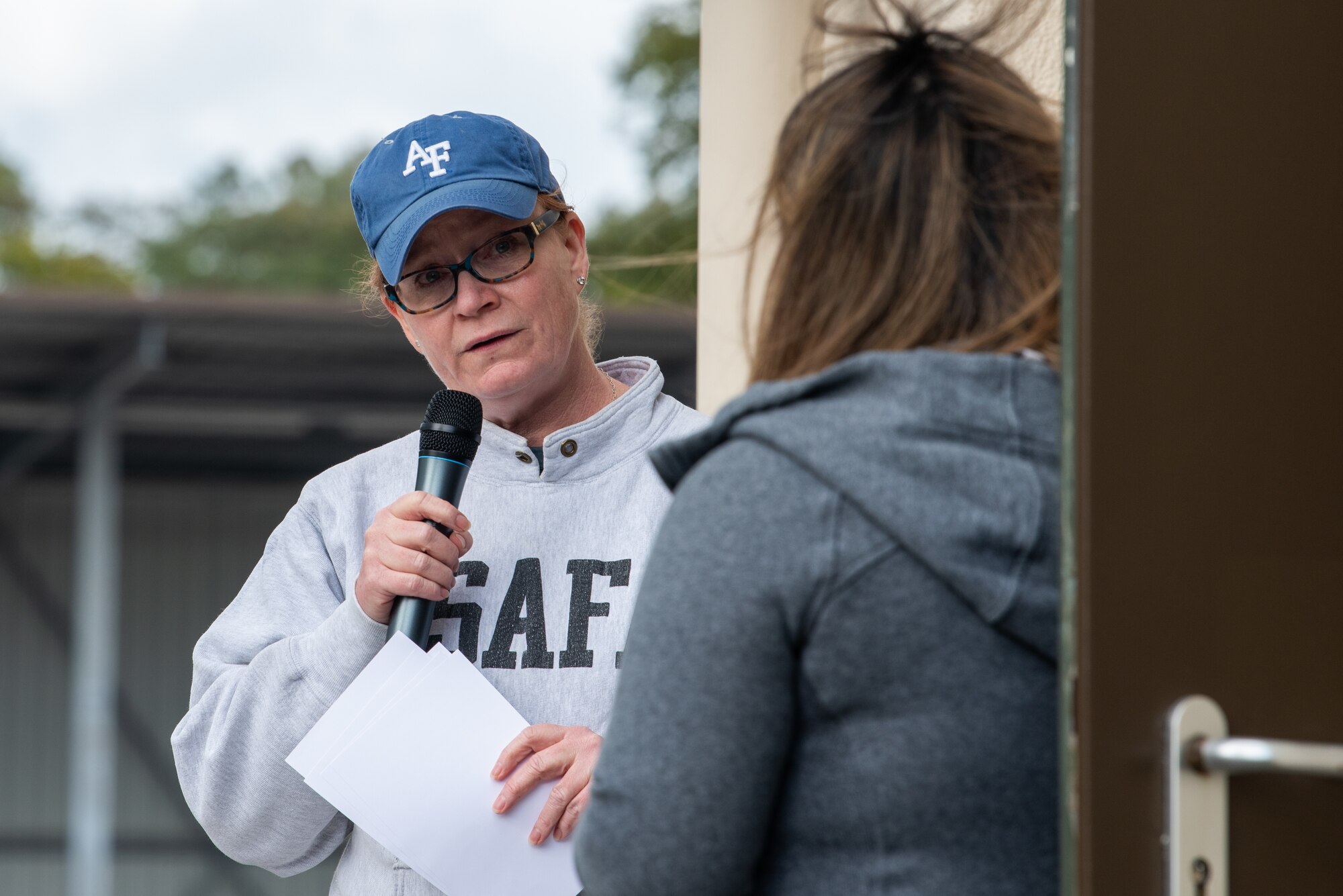 Brig. Gen. Adrienne Williams speaks to Sheena Pinero at Hope in Motion 5k.