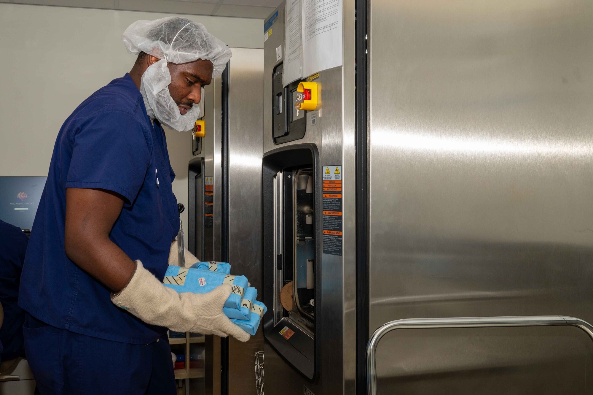 U.S. Air Force Airman 1st Class Julian Wells, 4th Operational Medical Readiness Squadron infection control monitor, loads dental instruments into a sterilizer at the Kiecker Dental Clinic located on Seymour Johnson Air Force Base, North Carolina, July 26, 2024. Wells makes sure all dental instruments are sterilized daily and ready for the next treatment, ensuring service members assigned to the 4th Fighter Wing can continue supporting the mission knowing their dental needs are met. (U.S. Air Force photo by Airman 1st Class Rebecca Tierney)