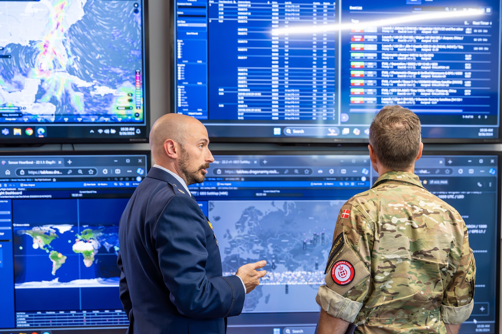 Two men looking at screen together