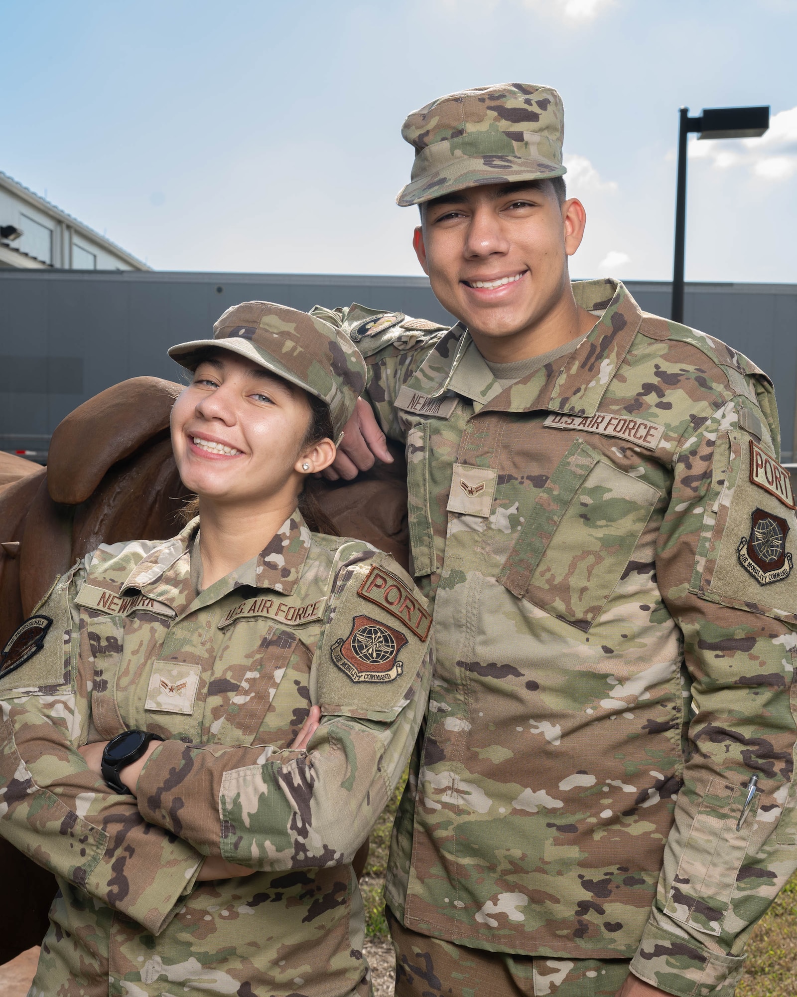 U.S. Air Force Airman 1st Class Brandi Newmark and her twin brother Airman 1st Class Mikal Newmark, both aerial transportation journeymen with the 70th Aerial Port Squadron at Homestead Air Force Base pose for a photo at Dover AFB, Delaware, Sept. 20, 2024. The siblings both enlisted in 2023 and have been together throughout basic training, technical school and their first temporary duty assignment to Dover AFB. (U.S. Air Force photo by Mauricio Campino)