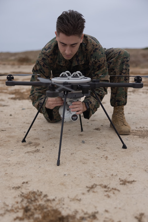 U.S. Marine Corps Lance Cpl. Christiaan Potgieter, a drone operator with Meteorological and Oceanographic Platoon, 1st Intelligence Battalion, I Marine Expeditionary Force Information Group, conducts maintenance on the R80D Sky Raider during Cobra Horizon 24.2 at Marine Corps Base Camp Pendleton, California, Sept. 25, 2024.Cobra Horizon is a semiannual training exercise that focuses on refining expeditionary meteorology and oceanographic employment, rapid response planning processes, and integrating a multi-service METOC environment to support future missions.  (U.S. Marine Corps photo by Sgt. Michael Virtue)