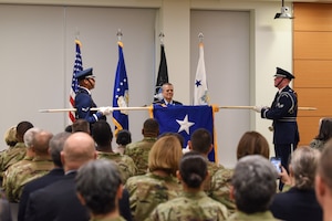 Image of a flag with people.