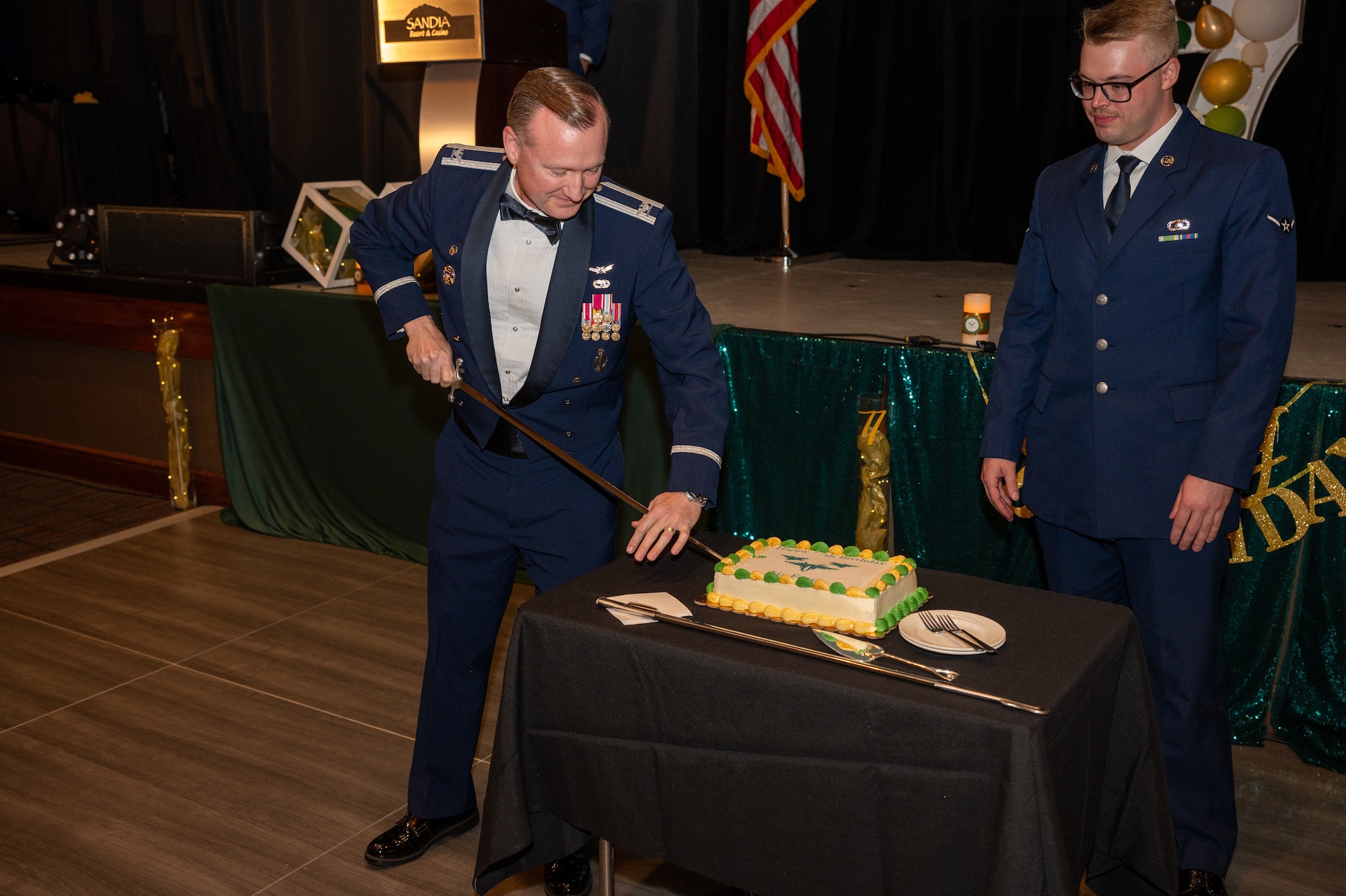 U.S. Air Force Col. David Wyrick, 377th Air Base Wing deputy commander and U.S. Air Force Airman Tyler Hatfield, 377th Mission Support Group contract specialist cut the cake at the 77th Annual Air Force Ball on Sept. 28 at Sandia Resort and Casino, Albuquerque, N.M.