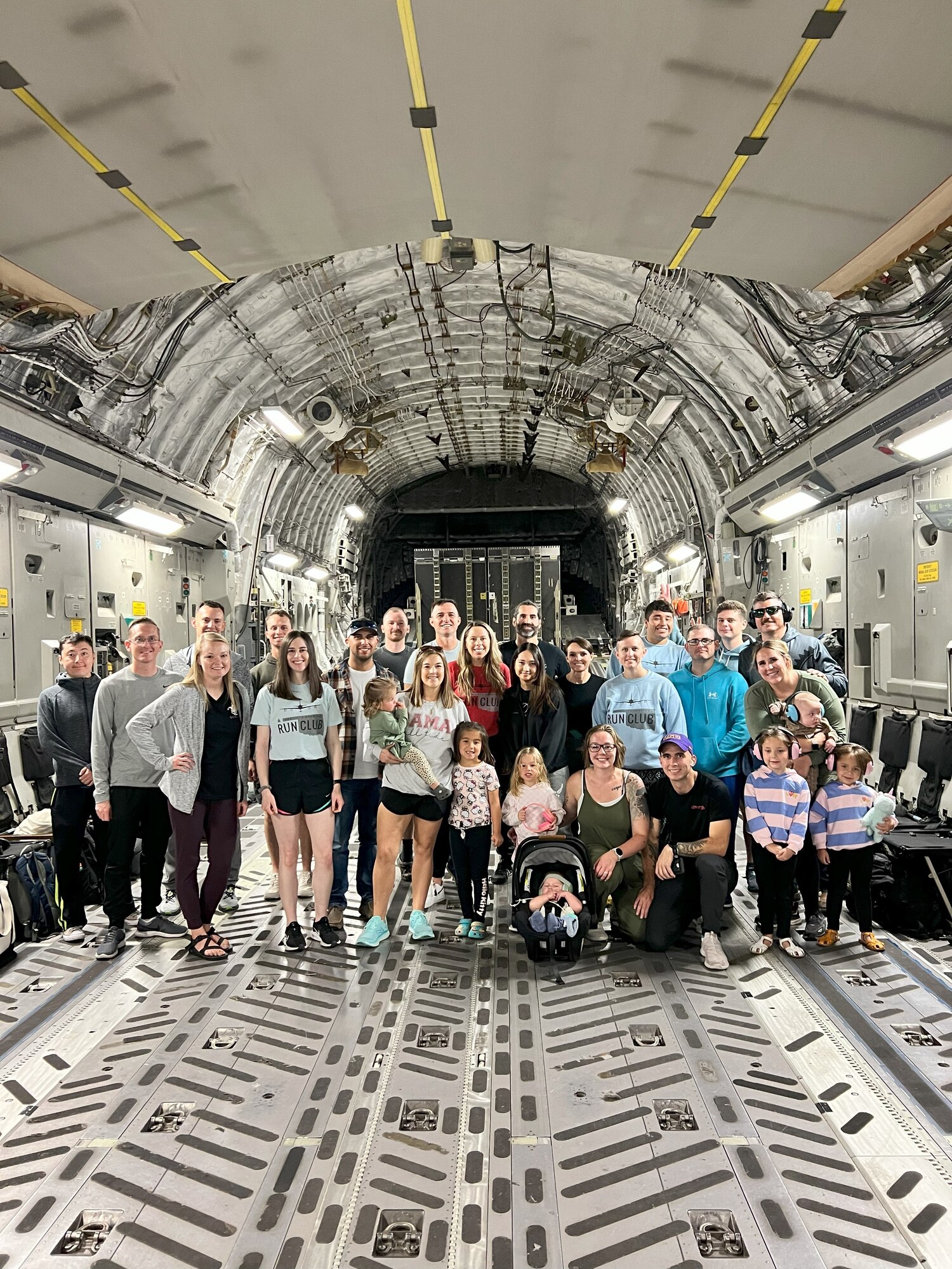 Members from Mobility’s Hometown Run Club and their families pose for a photo in a C-17 Globemaster III aircraft at Altus Air Force Base, Oklahoma, Sept. 19, 2024. The run club was created in Sept. 2023 to foster community and physical fitness. (Courtesy photo)