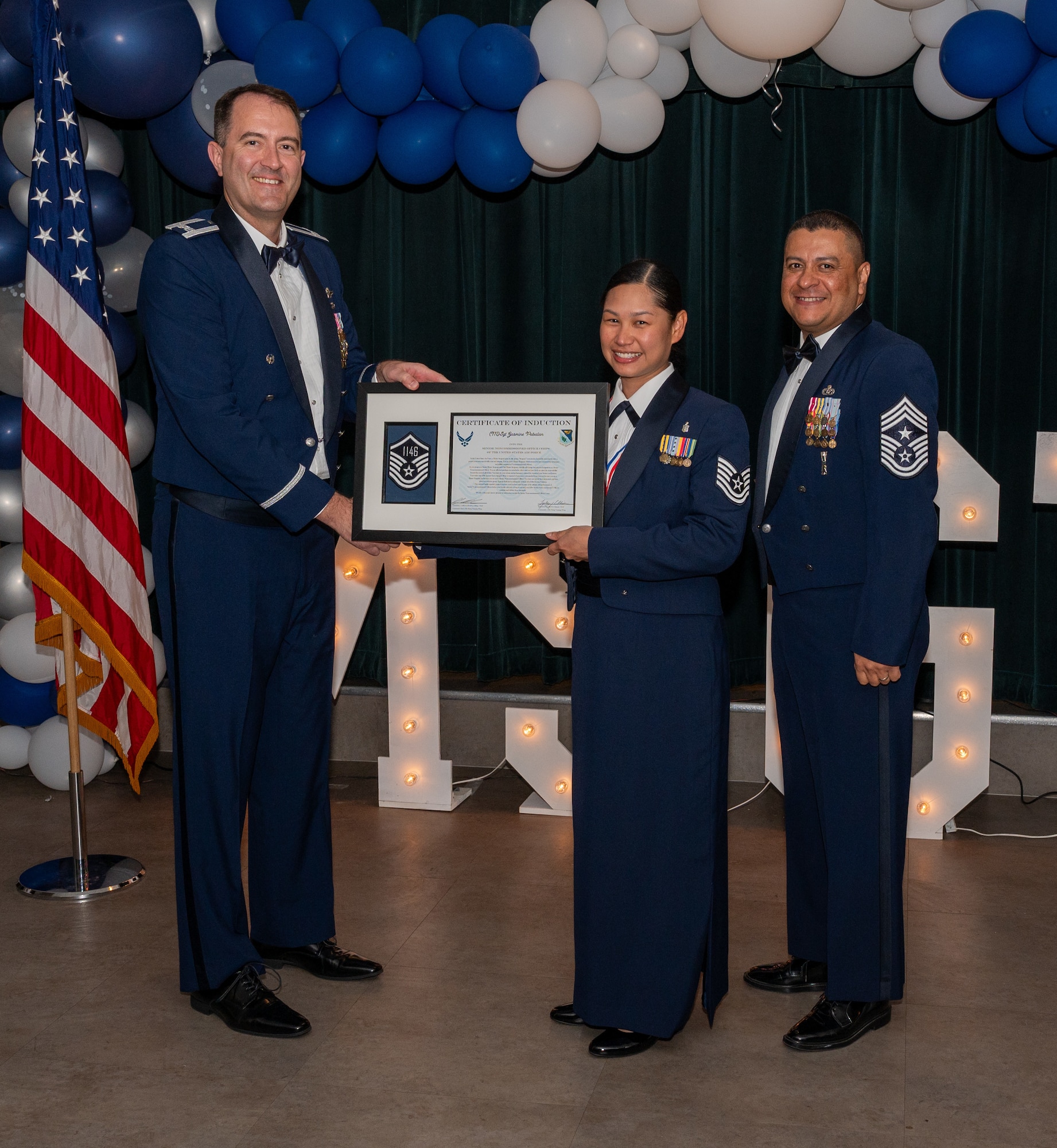 U.S. Air Force (M)Sgt Jasmine Pabalan, 47th Medical Group, accepts the certificate of induction during the senior non-commissioned officer (SNCO) induction ceremony at Laughlin Air Force Base, Texas, Sept. 27, 2024. The induction ceremony brings Airmen together to celebrate the achievement of entering the realm of senior enlisted leaders, as an SNCO they are expected to continue achieving the current and future Air Force vision with energy and strength. (U.S. Air Force photo by Staff Sgt. Nicholas Larsen)