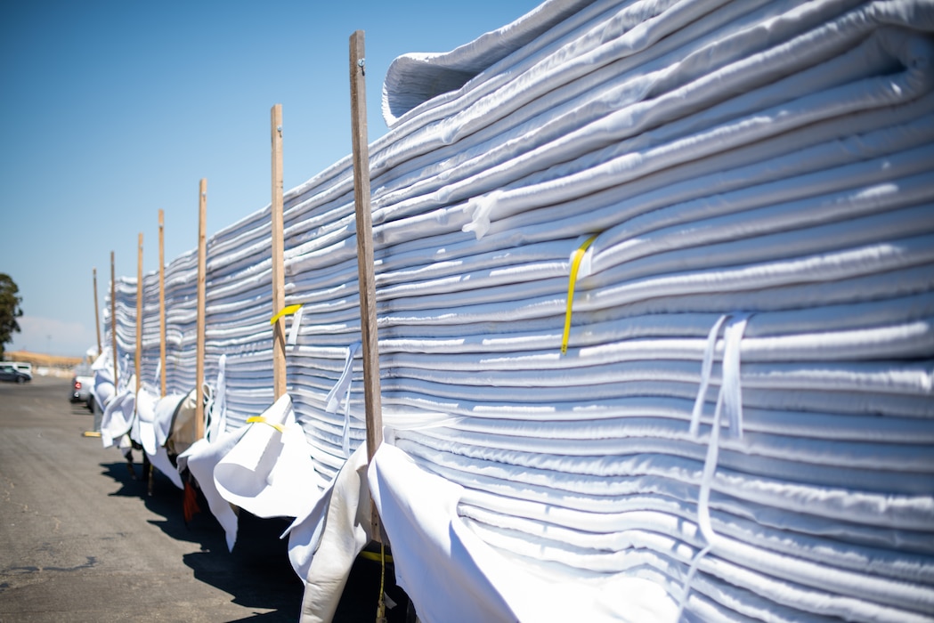 a photo of a truck bed full of liner for a temporary lake