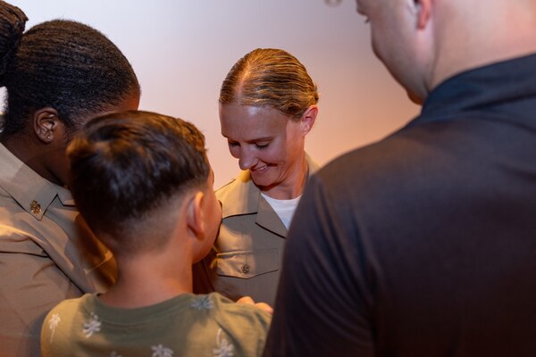 U.S. Navy Chief Petty Officer Jennifer McKenna, a newly appointed Chief Petty Officer with 2d Battalion, 2d Marine Regiment, 2d Marine Division, and a Clio, Michigan native, is pinned by her family members during a Chief Petty Officer pinning ceremony on Marine Corps Base Camp Lejeune, North Carolina, Sept. 27, 2024. Established by the Navy in 1893, the distinction for Chief Petty Officer was marked by changes in uniform and authority, with Chief Selects completing a six-week initiation that included physical fitness, team-building, and leadership training. (U.S. Marine Corps photo by Cpl. Alexis Sanchez)