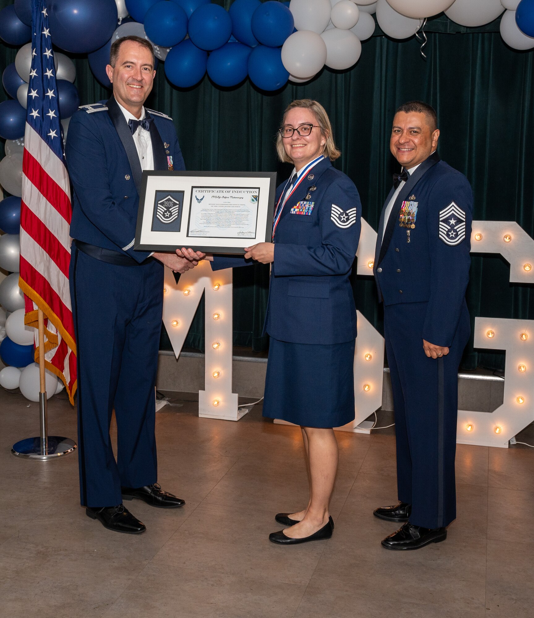 U.S. Air Force (M)Sgt Stefanie Nakoneczny, 47th Civil Engineering Squadron, accepts the certificate of induction during the senior non-commissioned officer (SNCO) induction ceremony at Laughlin Air Force Base, Texas, Sept. 27, 2024. The induction ceremony brings Airmen together to celebrate the achievement of entering the realm of senior enlisted leaders, as an SNCO they are expected to continue achieving the current and future Air Force vision with energy and strength. (U.S. Air Force photo by Staff Sgt. Nicholas Larsen)