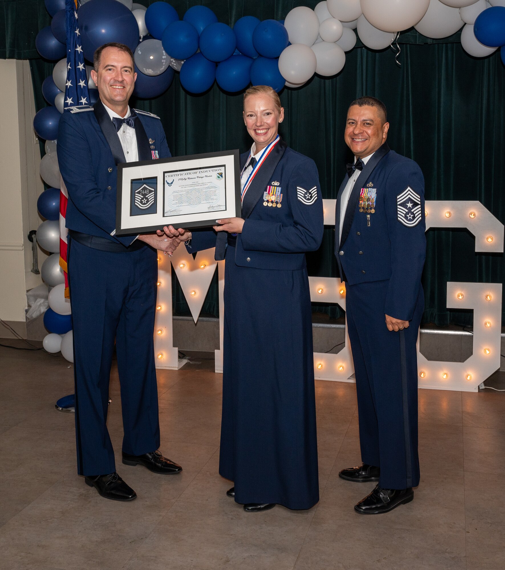 U.S. Air Force (M)Sgt Rebecca Pelayo-Reles, 47th Contracting Squadron, accepts the certificate of induction during the senior non-commissioned officer (SNCO) induction ceremony at Laughlin Air Force Base, Texas, Sept. 27, 2024. The induction ceremony brings Airmen together to celebrate the achievement of entering the realm of senior enlisted leaders, as an SNCO they are expected to continue achieving the current and future Air Force vision with energy and strength. (U.S. Air Force photo by Staff Sgt. Nicholas Larsen)