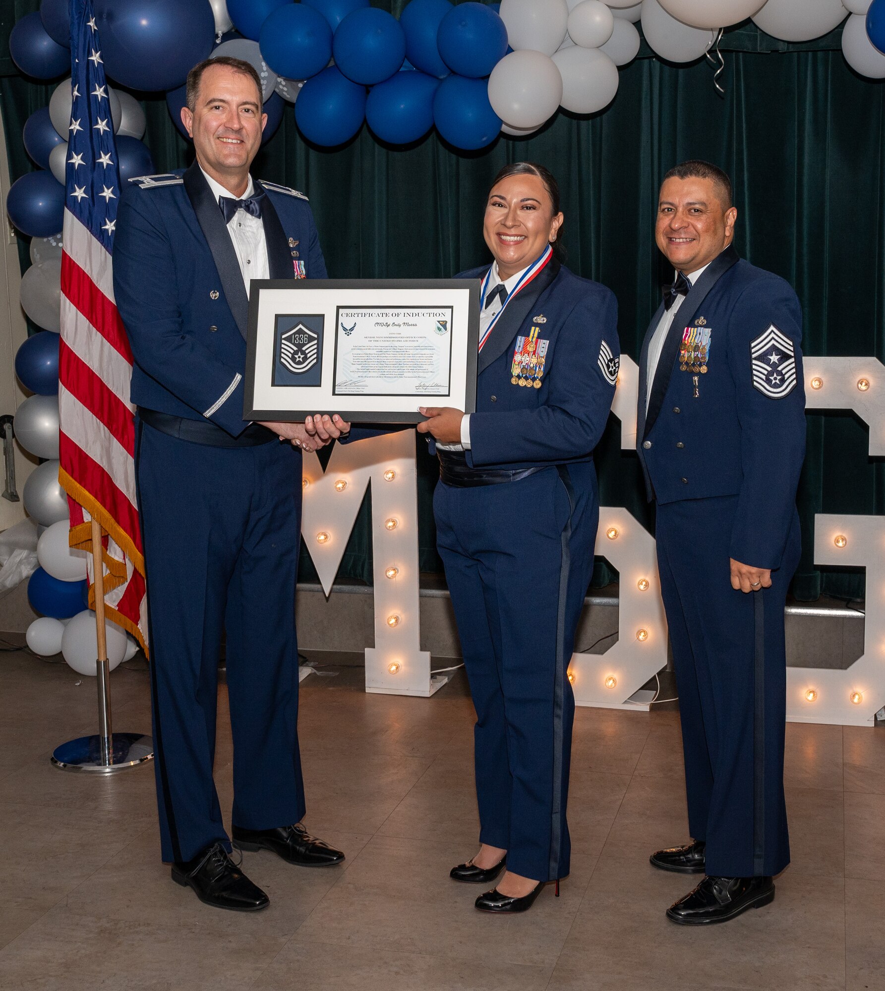 U.S. Air Force (M)Sgt Emily Morris, 47th Security Forces Squadron, accepts the certificate of induction during the senior non-commissioned officer (SNCO) induction ceremony at Laughlin Air Force Base, Texas, Sept. 27, 2024. The induction ceremony brings Airmen together to celebrate the achievement of entering the realm of senior enlisted leaders, as an SNCO they are expected to continue achieving the current and future Air Force vision with energy and strength. (U.S. Air Force photo by Staff Sgt. Nicholas Larsen)