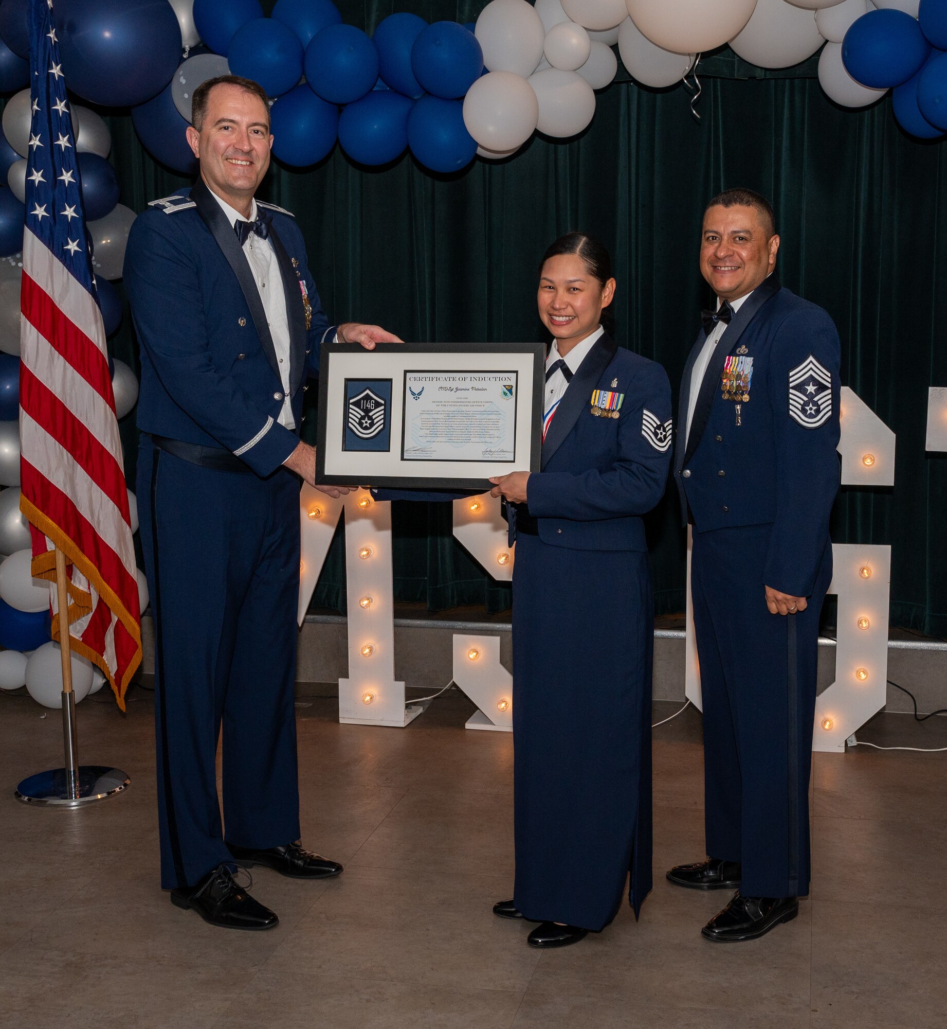 U.S. Air Force (M)Sgt Jasmine Pabalan, 47th Medical Group, accepts the certificate of induction during the senior non-commissioned officer (SNCO) induction ceremony at Laughlin Air Force Base, Texas, Sept. 27, 2024. The induction ceremony brings Airmen together to celebrate the achievement of entering the realm of senior enlisted leaders, as an SNCO they are expected to continue achieving the current and future Air Force vision with energy and strength. (U.S. Air Force photo by Staff Sgt. Nicholas Larsen)