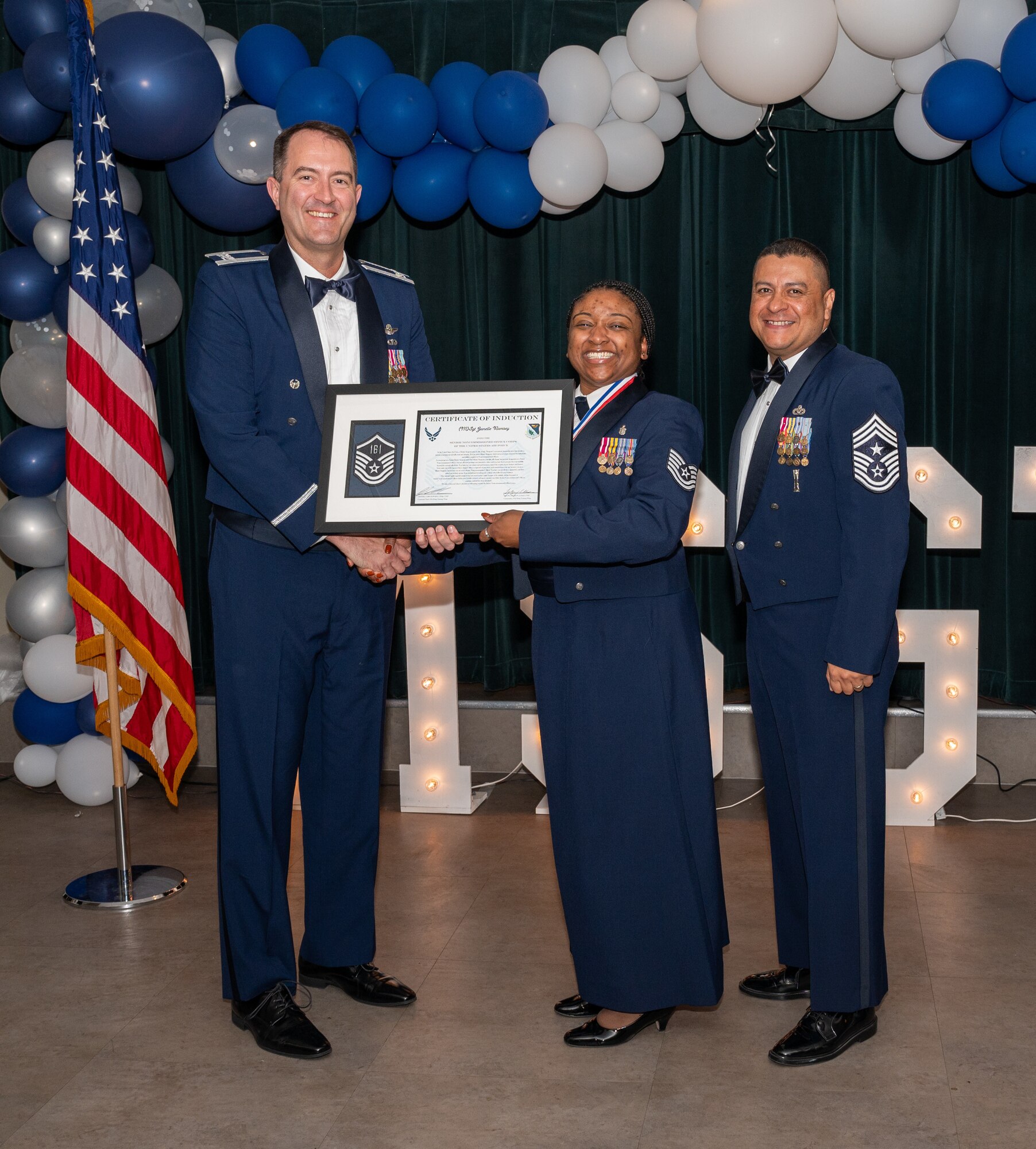 U.S. Air Force (M)Sgt Janelle Ramsey, 47th Medical Group, accepts the certificate of induction during the senior non-commissioned officer (SNCO) induction ceremony at Laughlin Air Force Base, Texas, Sept. 27, 2024. The induction ceremony brings Airmen together to celebrate the achievement of entering the realm of senior enlisted leaders, as an SNCO they are expected to continue achieving the current and future Air Force vision with energy and strength. (U.S. Air Force photo by Staff Sgt. Nicholas Larsen)