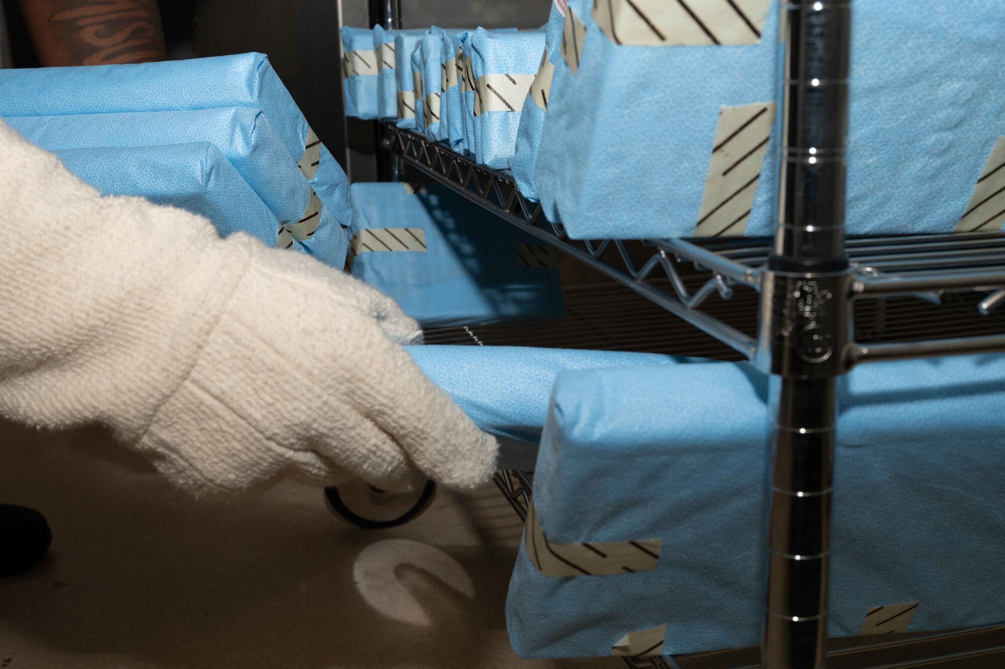 U.S. Air Force Airman 1st Class Julian Wells, 4th Operational Medical Readiness Squadron infection control monitor, loads sterilized dental instruments onto a cart at the Kiecker Dental Clinic located on Seymour Johnson Air Force Base, North Carolina, July 26, 2024. Wells makes sure all dental instruments are sterilized daily and ready for the next treatment, ensuring service members assigned to the 4th Fighter Wing can continue supporting the mission knowing their dental needs are met. (U.S. Air Force photo by Airman 1st Class Rebecca Tierney)