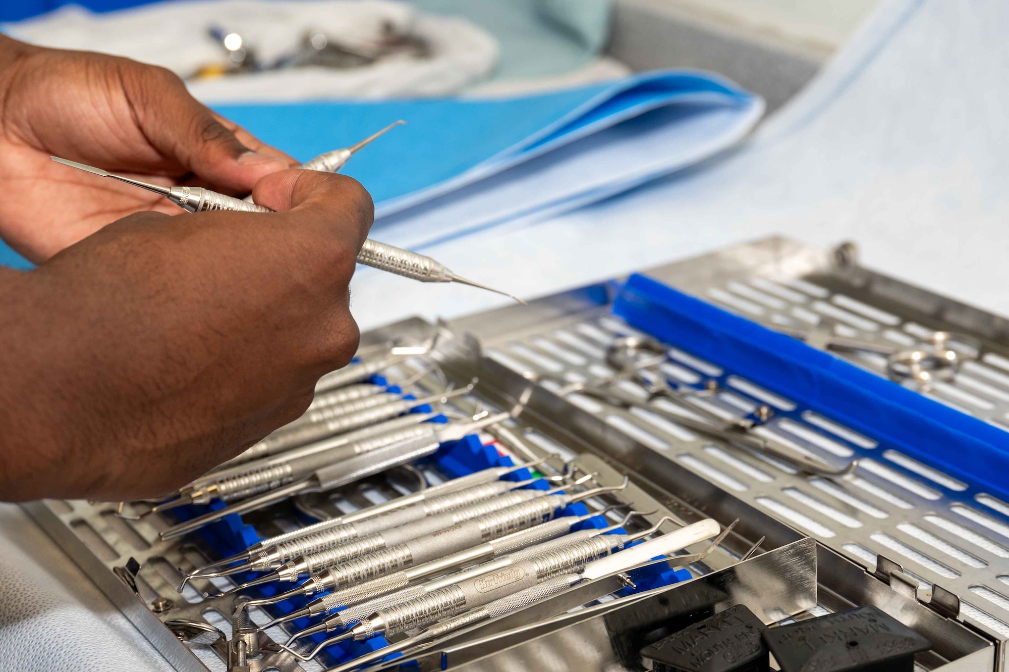 U.S. Air Force Airman 1st Class Julian Wells, 4th Operational Medical Readiness Squadron infection control monitor, arranges dental instruments in a cassette at the Kiecker Dental Clinic located on Seymour Johnson Air Force Base, North Carolina, July 26, 2024. Wells makes sure all dental instruments are sterilized daily and ready for the next treatment, ensuring service members assigned to the 4th Fighter Wing can continue supporting the mission knowing their dental needs are met. (U.S. Air Force photo by Airman 1st Class Rebecca Tierney)