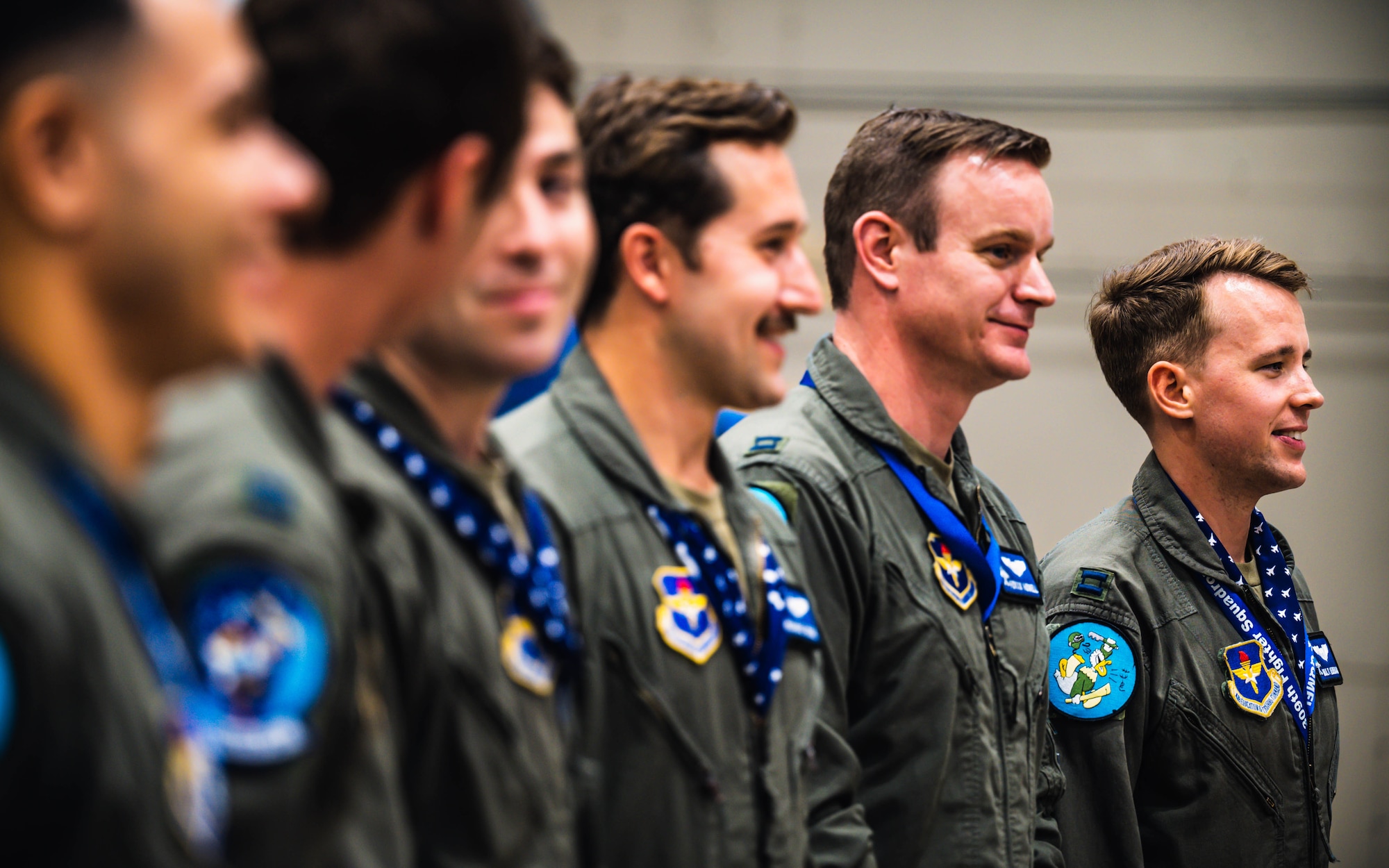 U.S. Air Force graduated pilots from the 309th Fighter Squadron stand in line during the final 309th FS graduation for F-16 Fighting Falcon pilots.