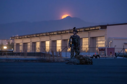 U.S. Air Force Senior Airman Bryan Woody, 374 SFS patrolman, secures a perimeter during a fly-away security field training exercise at Yokota Air Base, Japan, March 14, 2025. During the course, FAST participants honed their skills in verbal judo, security tactics, and mission planning.
